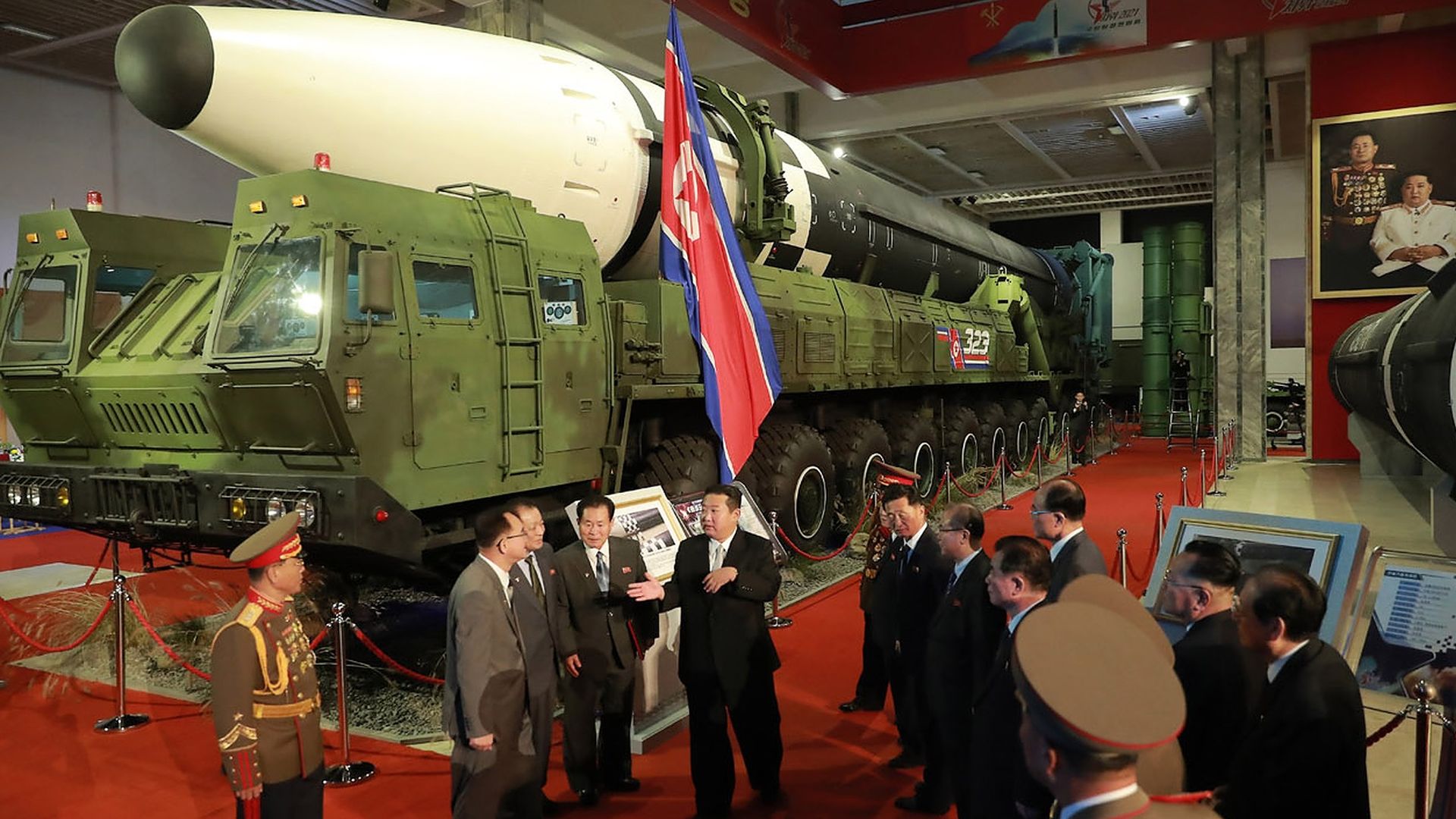 North Korean leader Kim Jong-un surrounded by military members at the National Defence Development Exhibition: Self-Defense 2021"