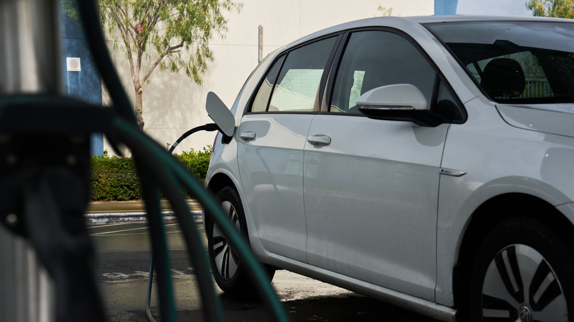 A Volkswagen e-Golf charges at a electric vehicle (EV) charger in California