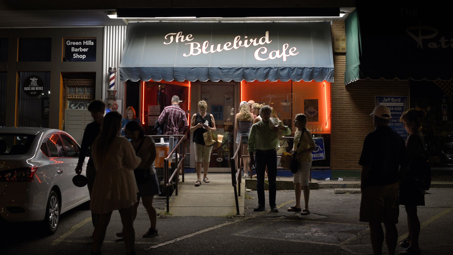 A crowd gathers outside the iconic Bluebird Cafe in Nashville, Tennessee