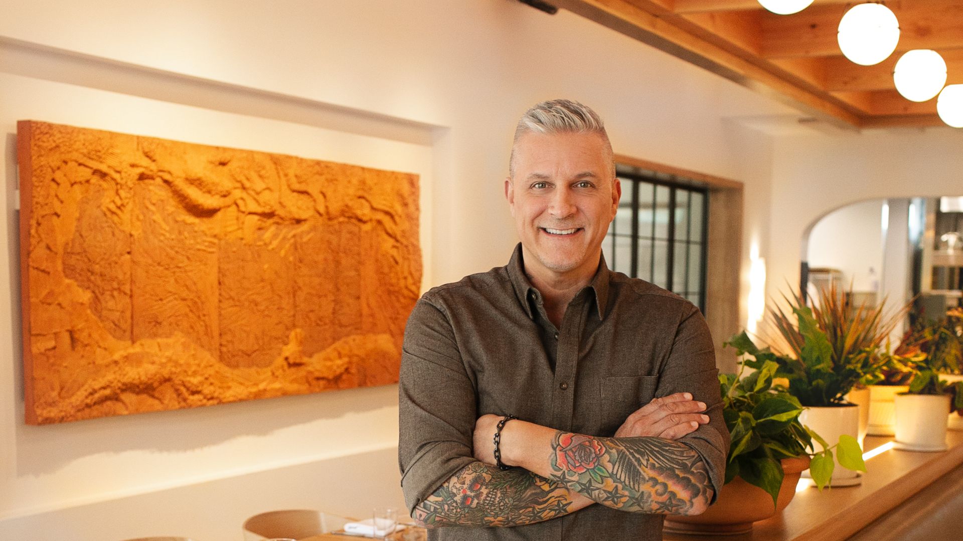 Raleigh chef Scott Crawwford stands with his arms crossed