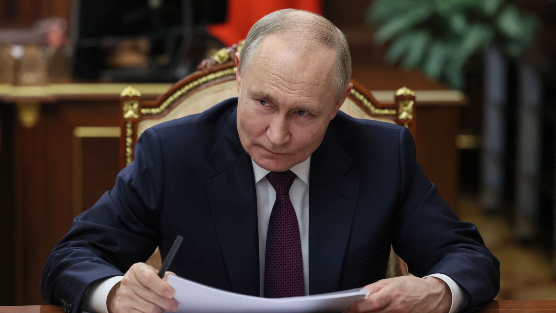  In this pool photograph distributed by Russian state agency Sputnik, Russia's President Vladimir Putin attends a meeting with Head of Republic of Tatarstan in Moscow on March 3, 2025. 