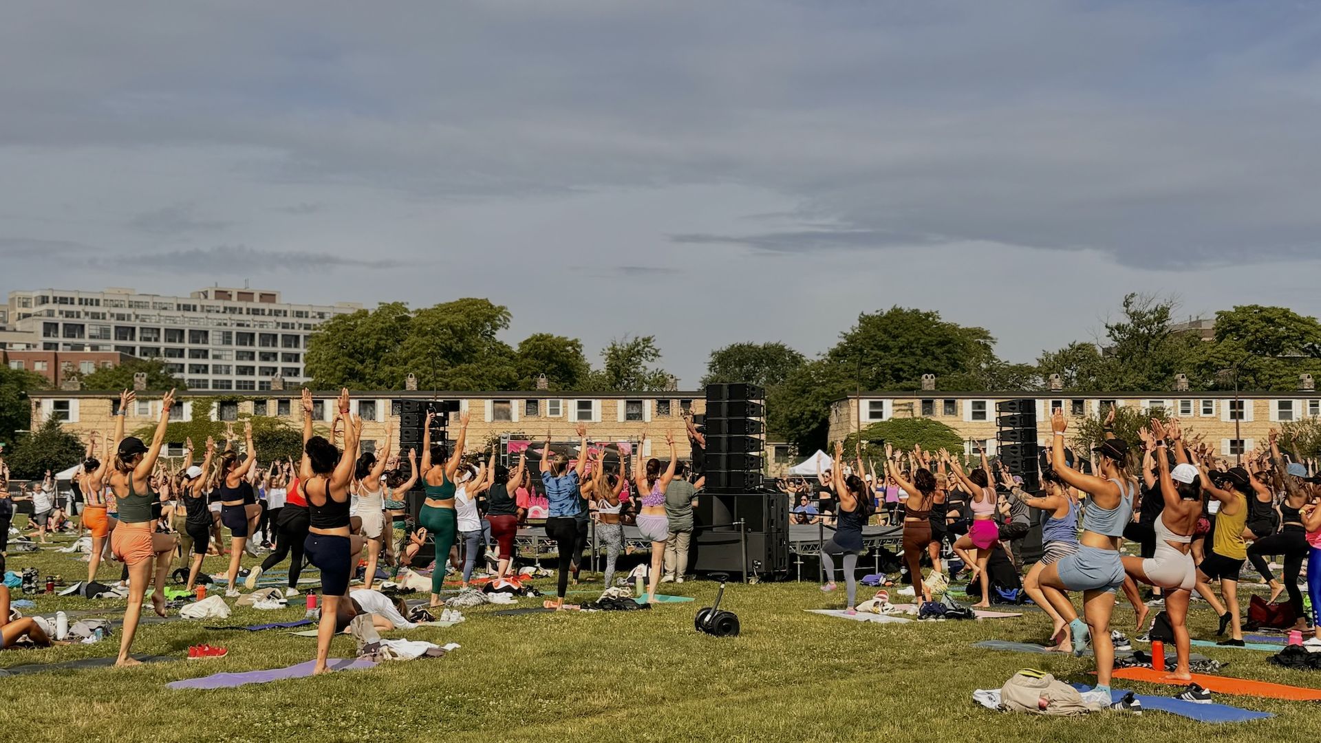 People working out together on a lawn.