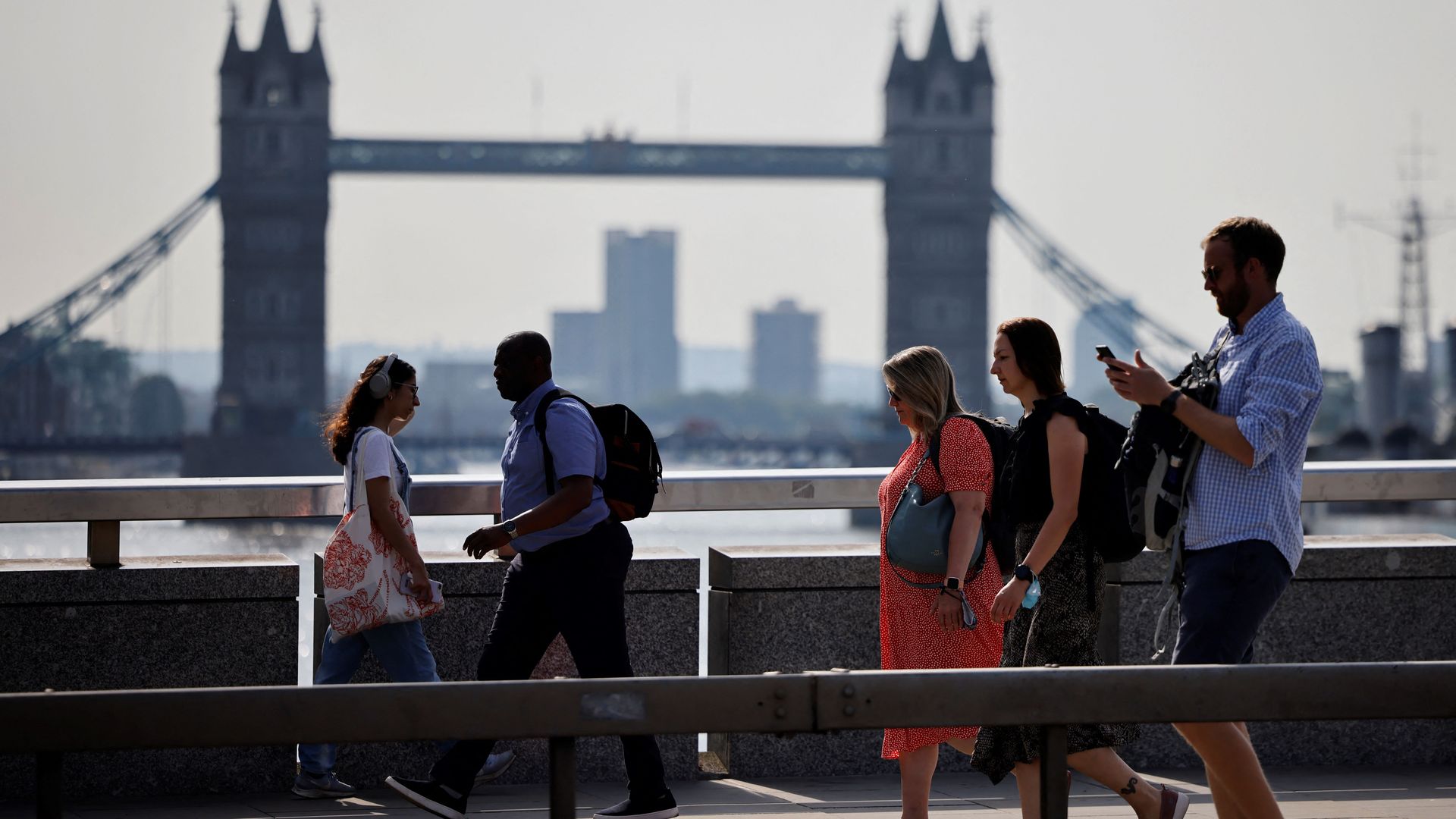 People walking in London without face masks on July 19.