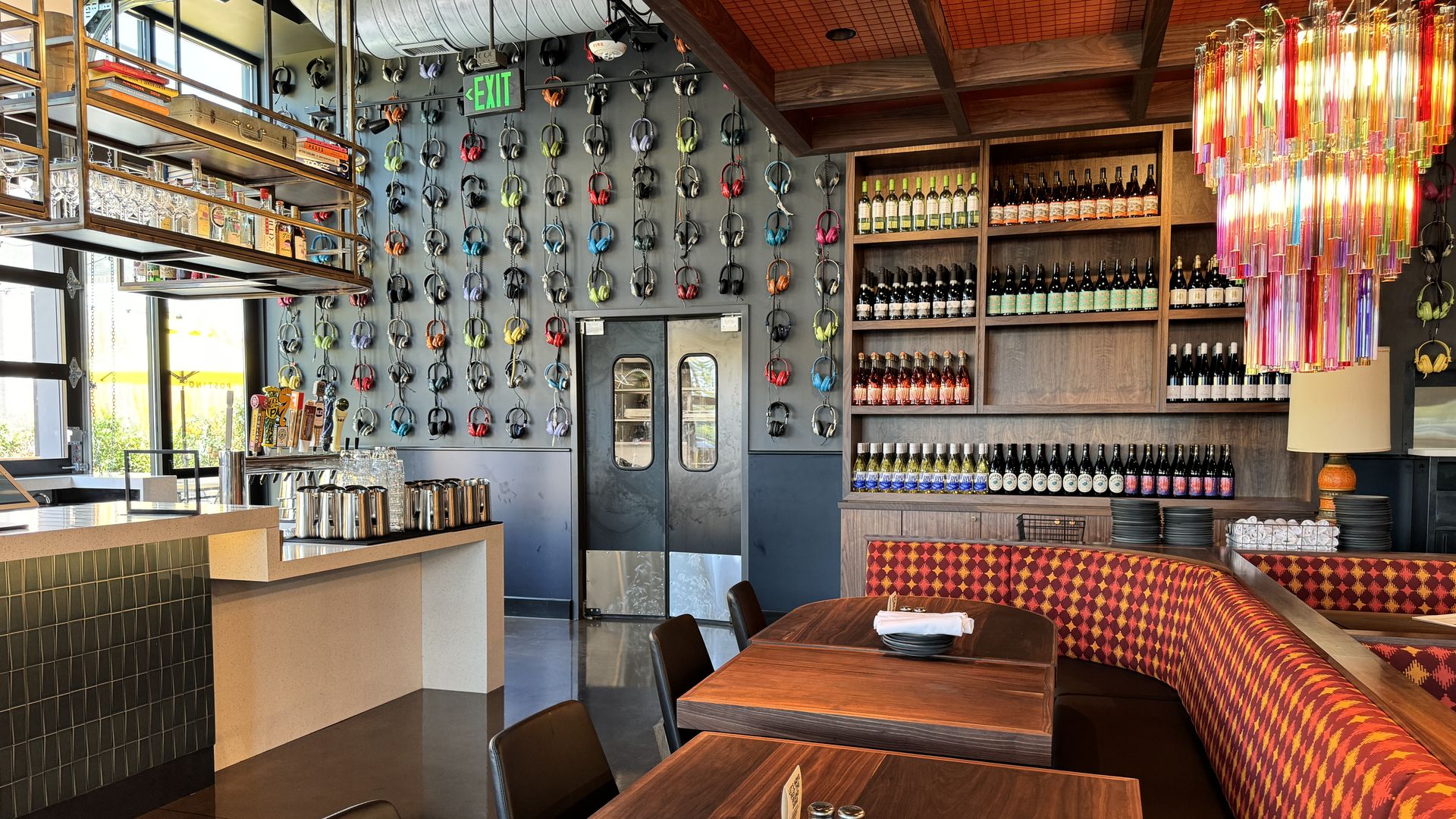 inside new wine bar with headphones covering the wall
