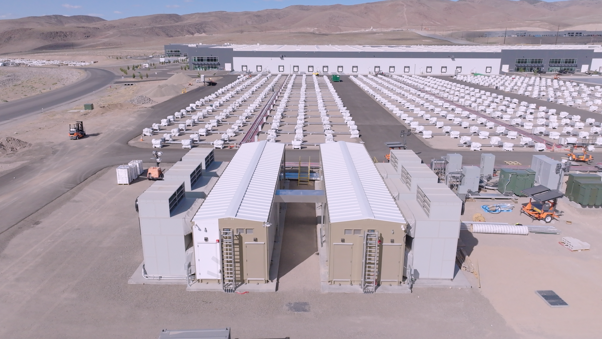 Two modular data centers built by Crusoe, powered by solar and batteries in the Tahoe-Reno Industrial Center. Photo: Courtesy of Redwood Materials.