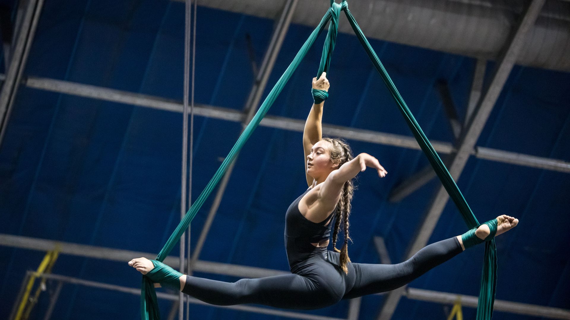 girl practices silks for circus performance