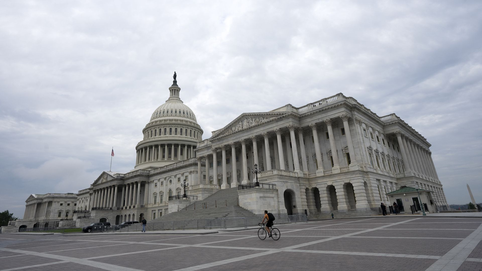 A bicyclist rides past the United States Capitol on August 6, 2020 in Washington, DC.