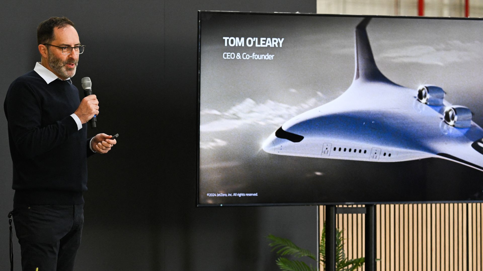 Tom O'Leary, JetZero CEO and co-founder, speaks about the JetZero Z4 blended wing body aircraft during the company's media day in Long Beach, California on May 2, 2025. JetZero is developing the world's first commercial all-wing design airplane. (Photo by Patrick T. Fallon / AFP) (Photo by PATRICK T