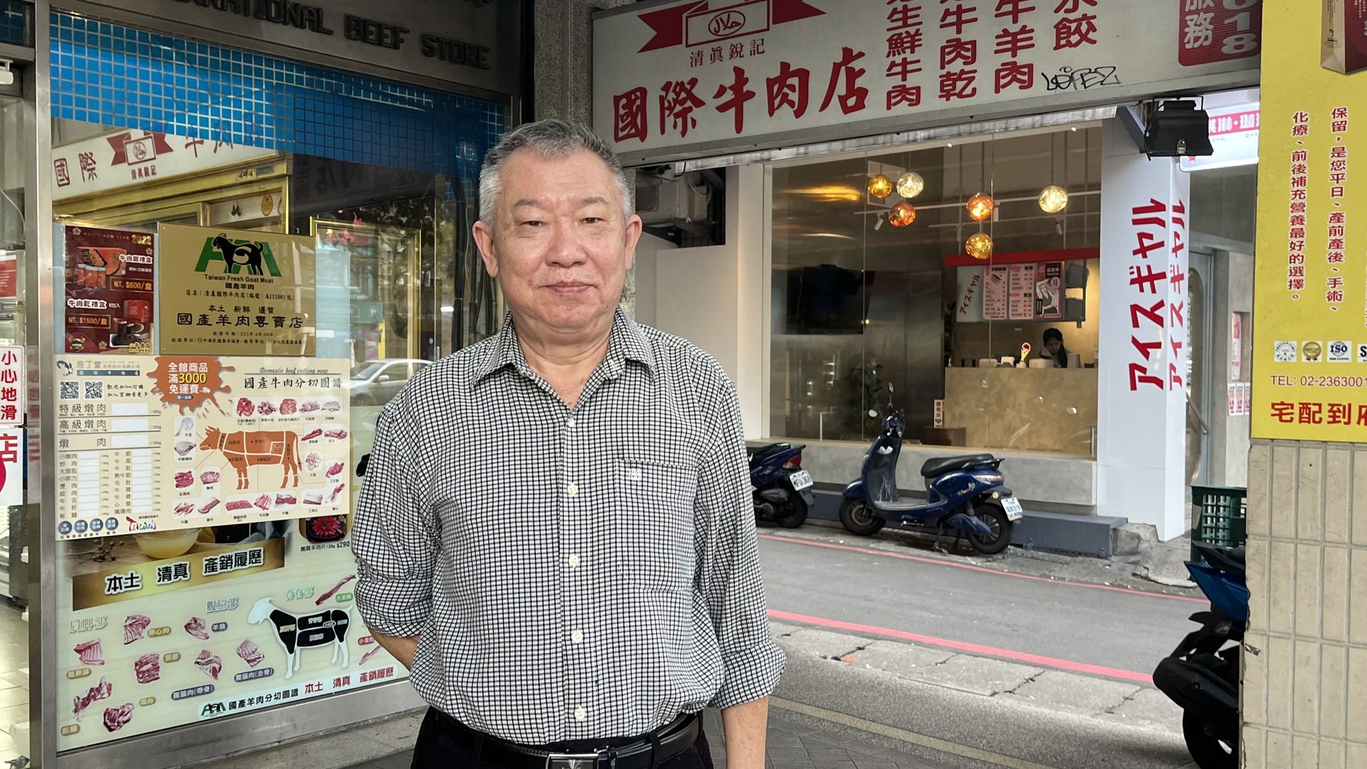 Mohammed Ma stands in front of a halal butcher shop in Taipei, Taiwan.