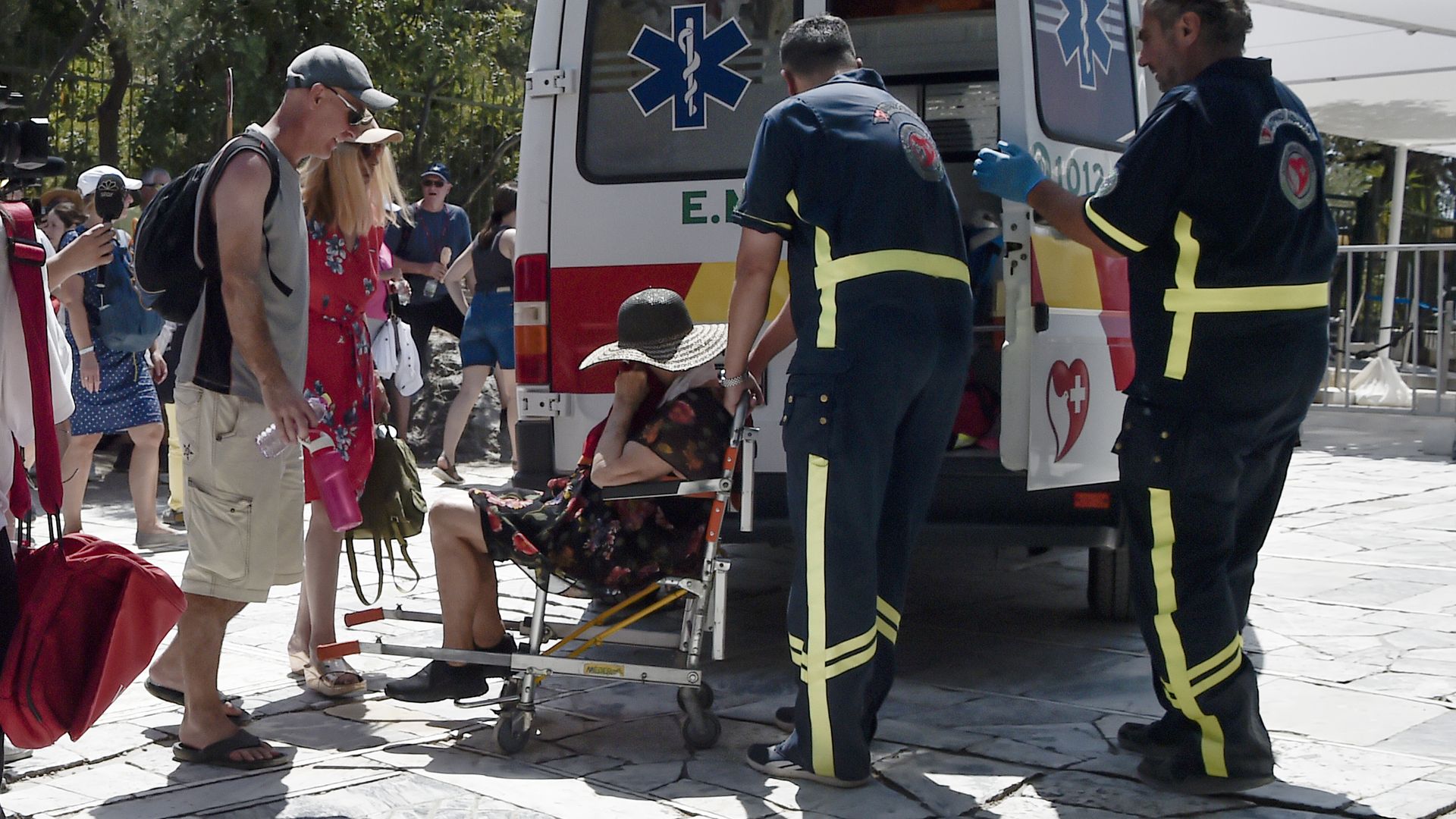 Medics helping a person in Athens, Greece, in July 2023.