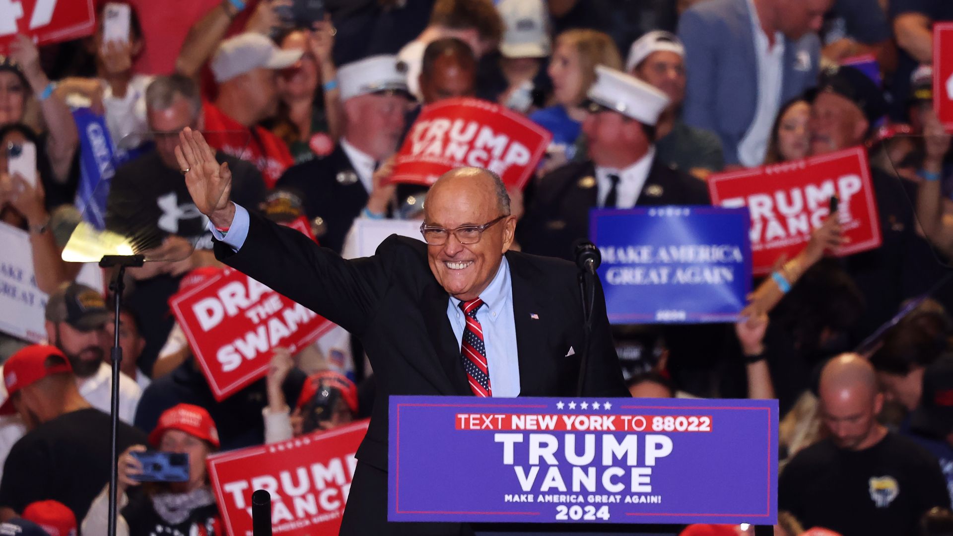 Rudy Giuliani waves to the crowd at a campaign rally in New York.