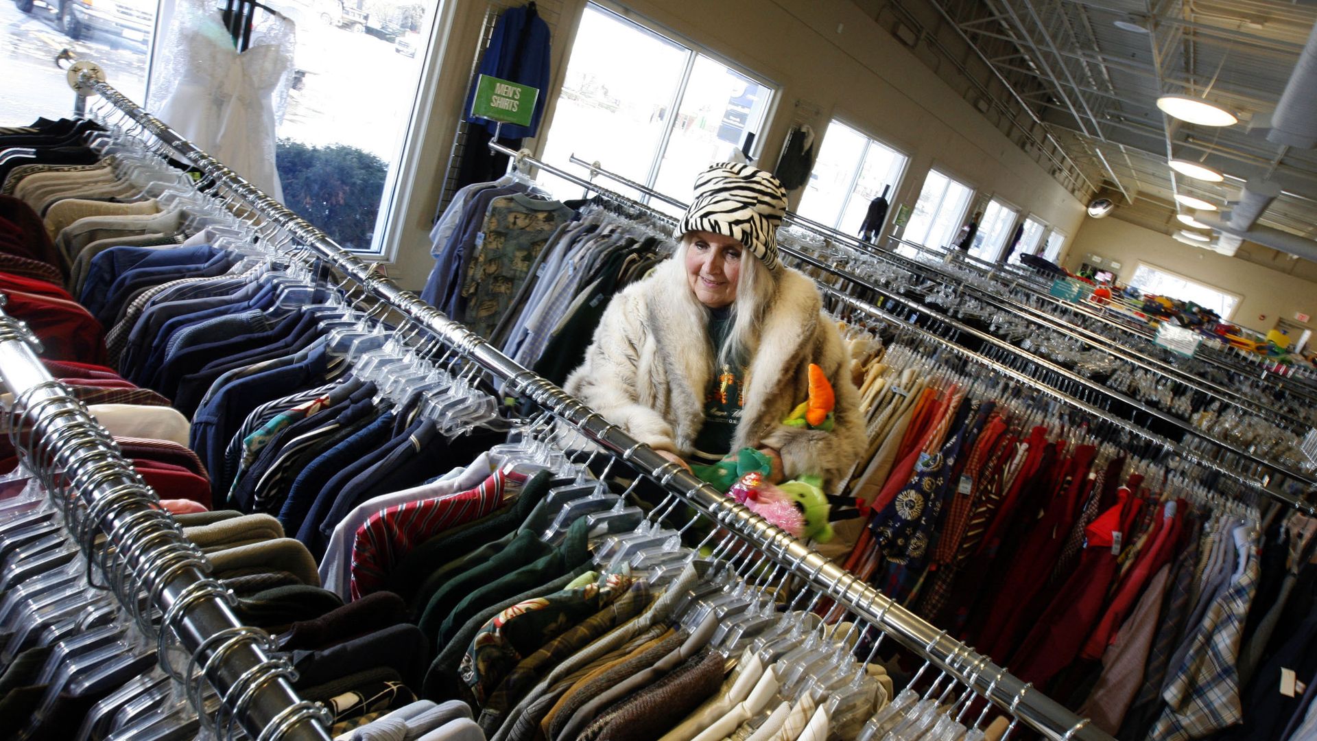 woman shopping at a thrift store 