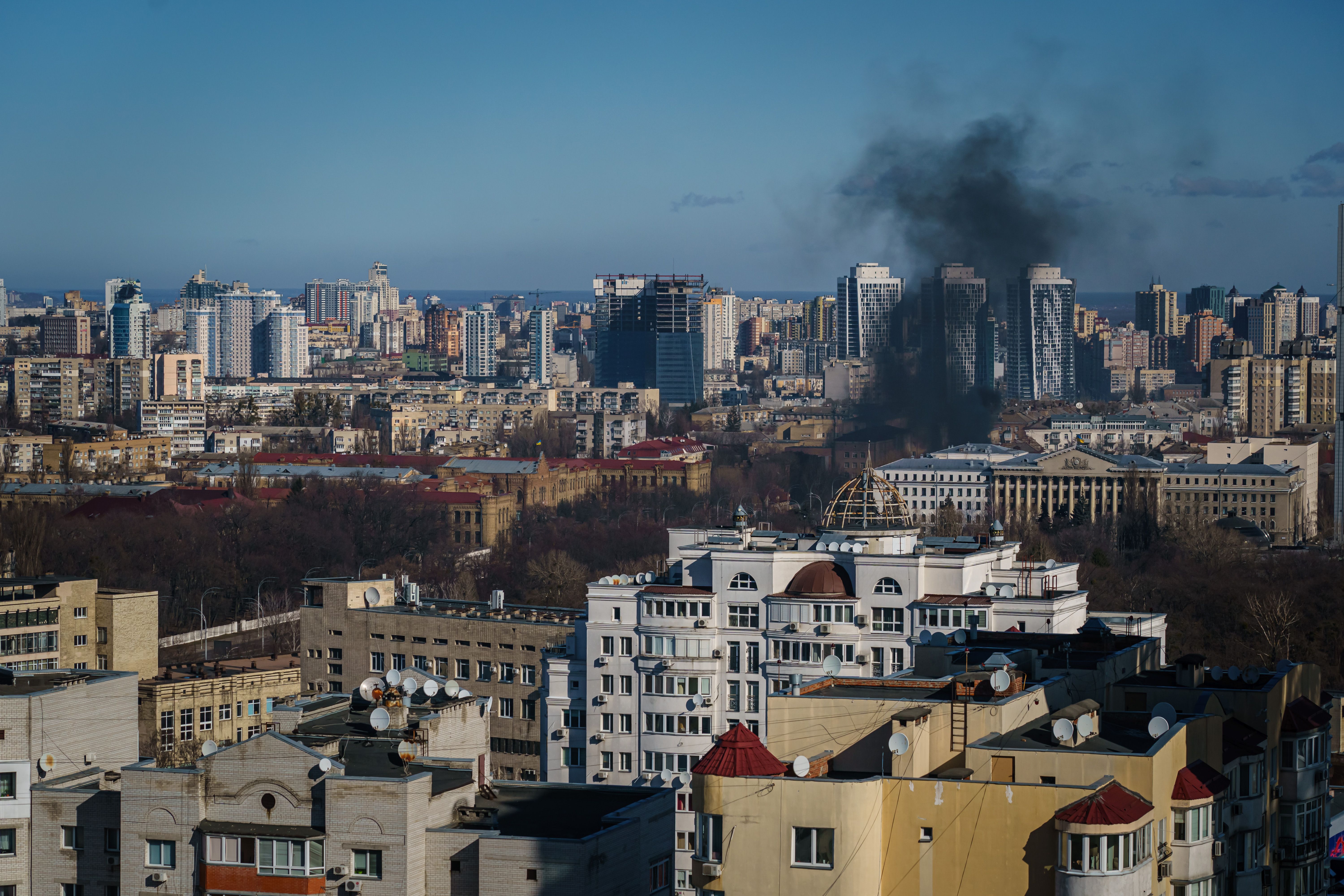 A smoke column rises after an attack in Kyiv, Ukraine, Saturday, Feb. 26.