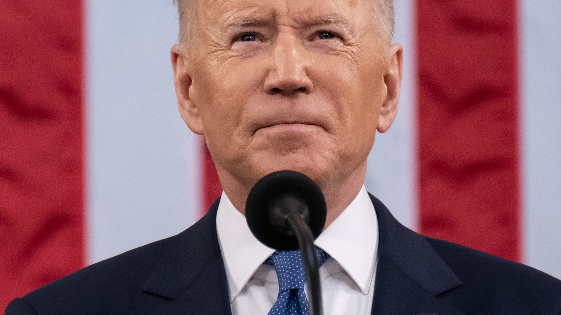 Photo of Joe Biden looking up with his mouth in a firm line