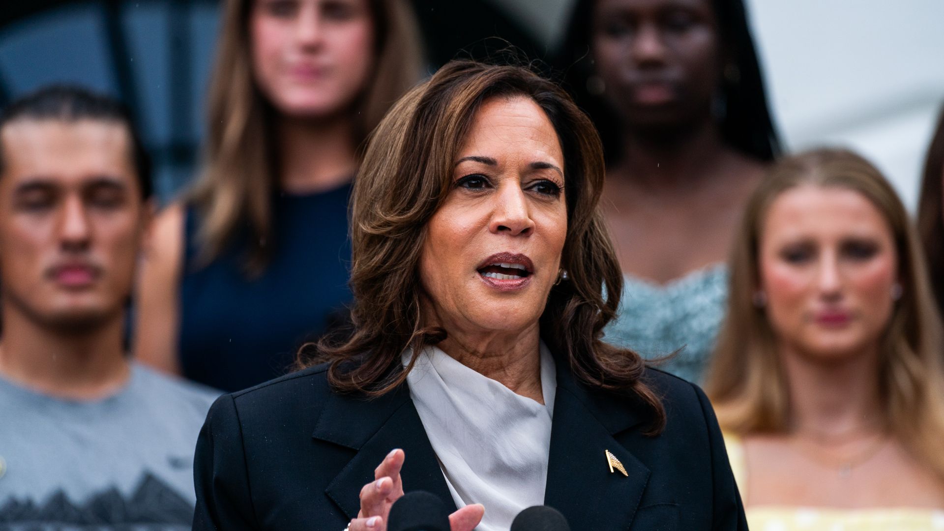 Kamala Harris speaks with audience members visible behind her 