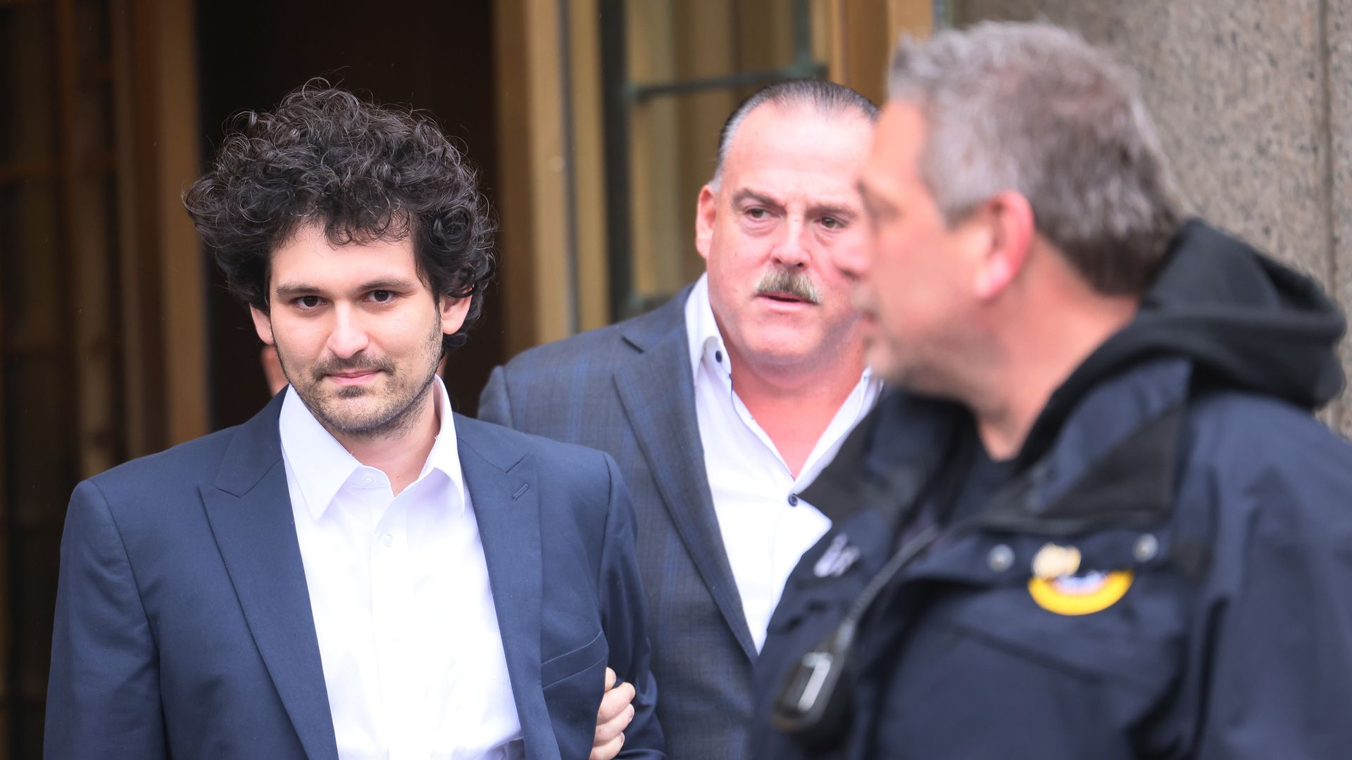 Sam Bankman-Fried leaves New York courthouse.