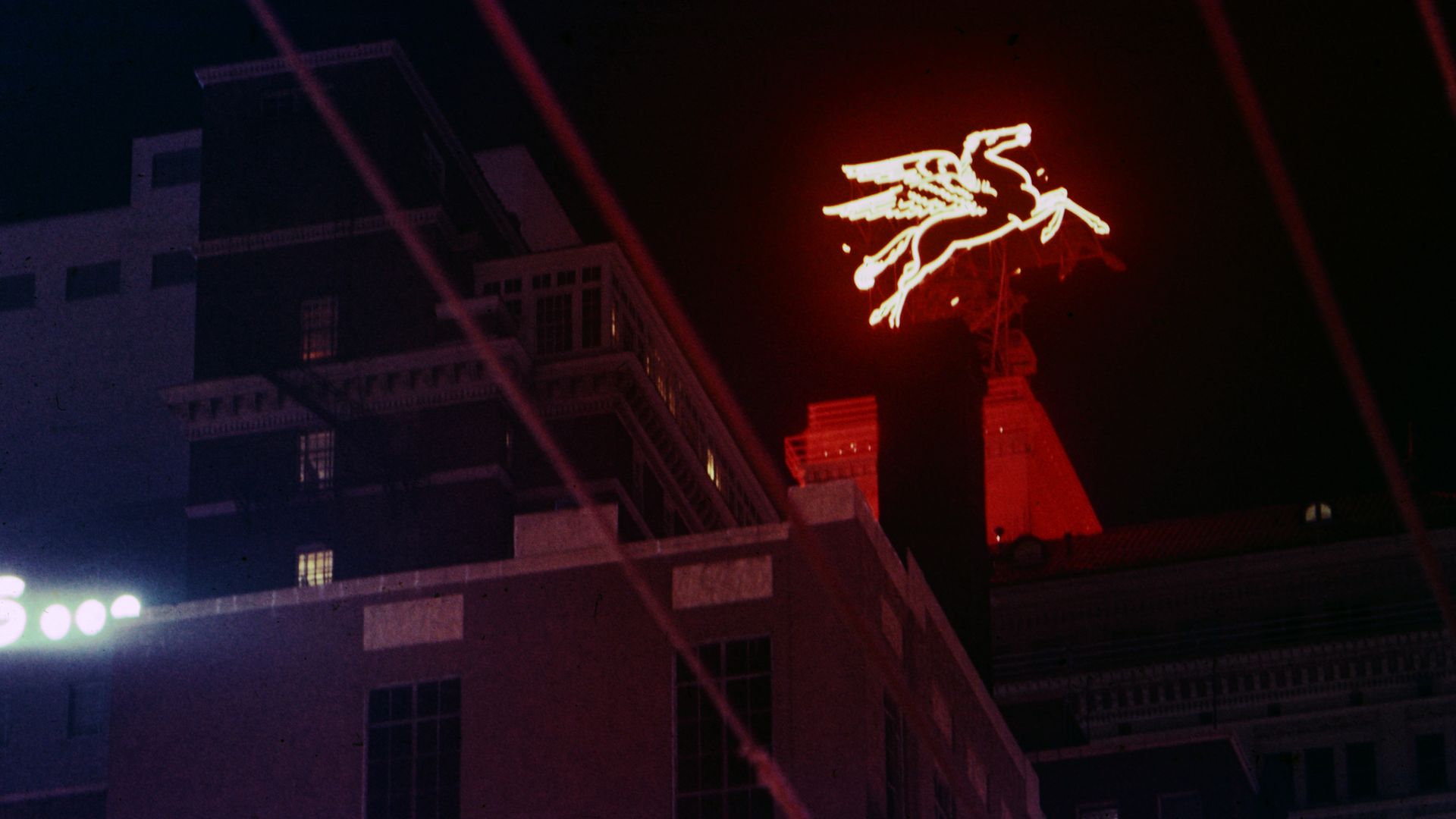 A red neon sign of a pegasus in Dallas 