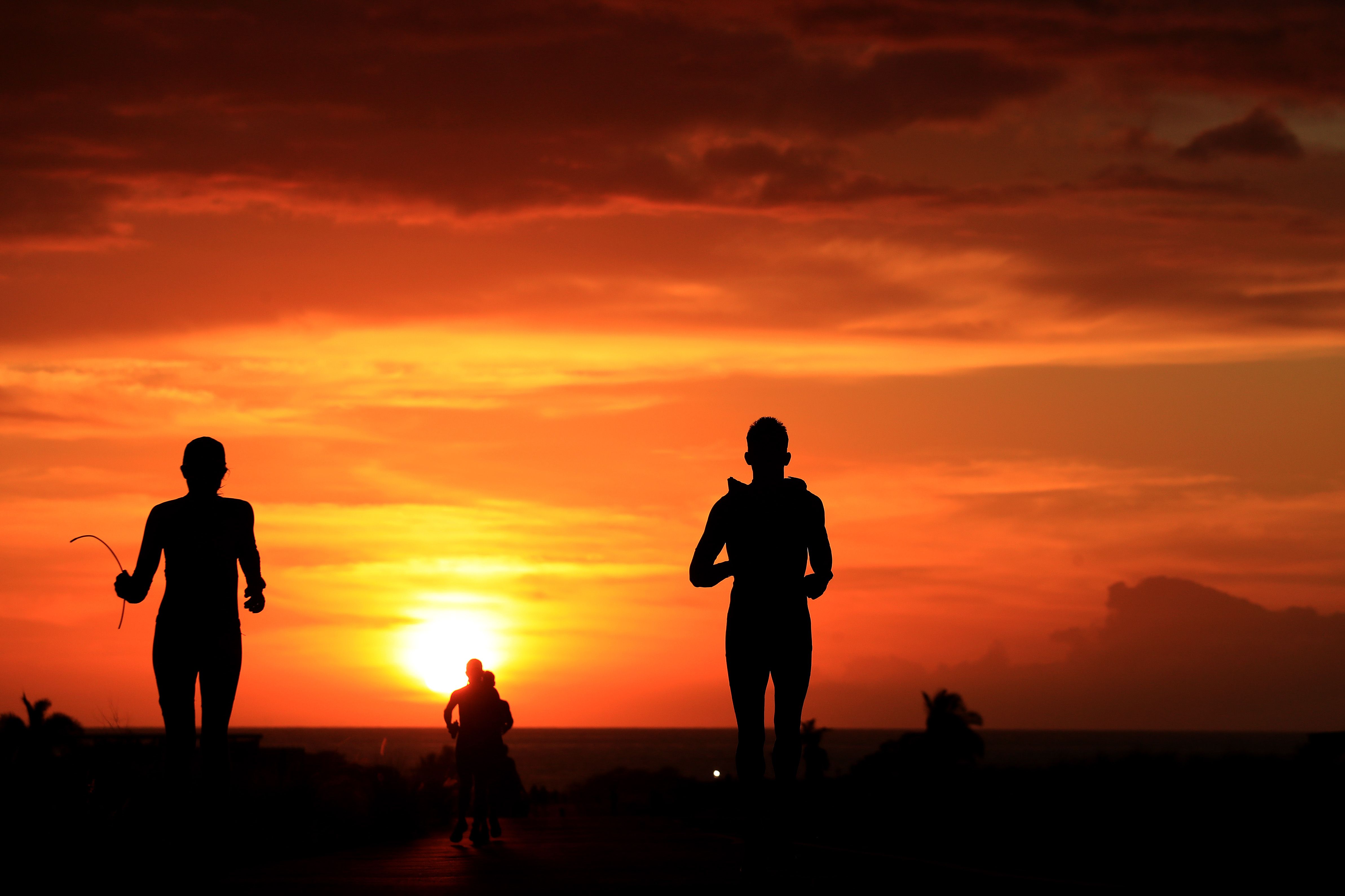 Runners at sunset