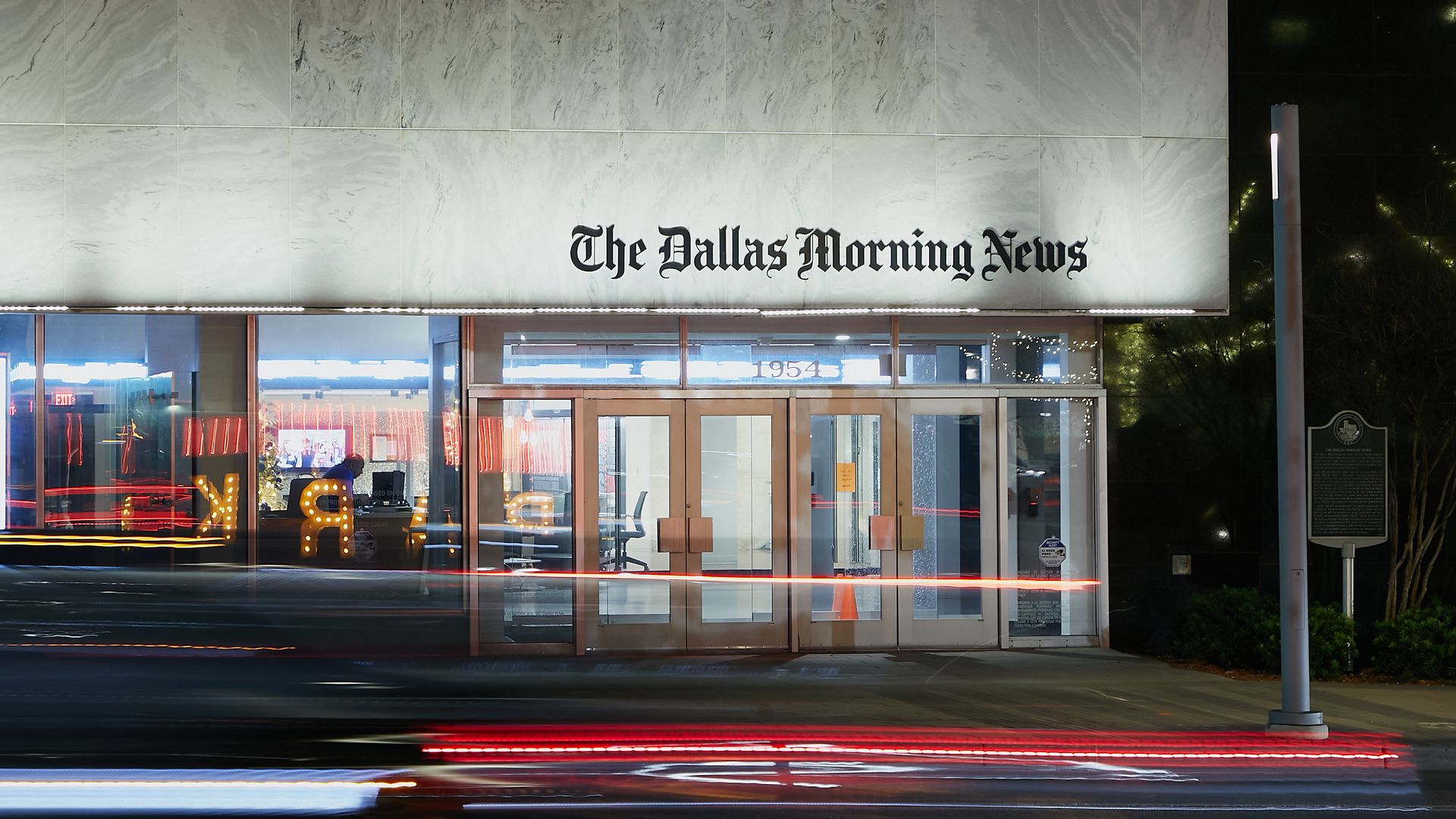 A building that says "The Dallas Morning News" above the door