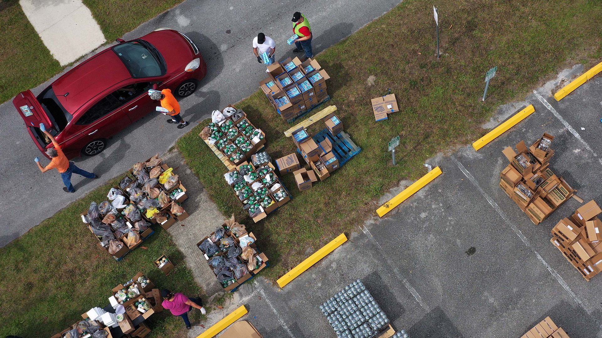 Volunteers distribute food from the Second Harvest Food Bank of Central Florida.