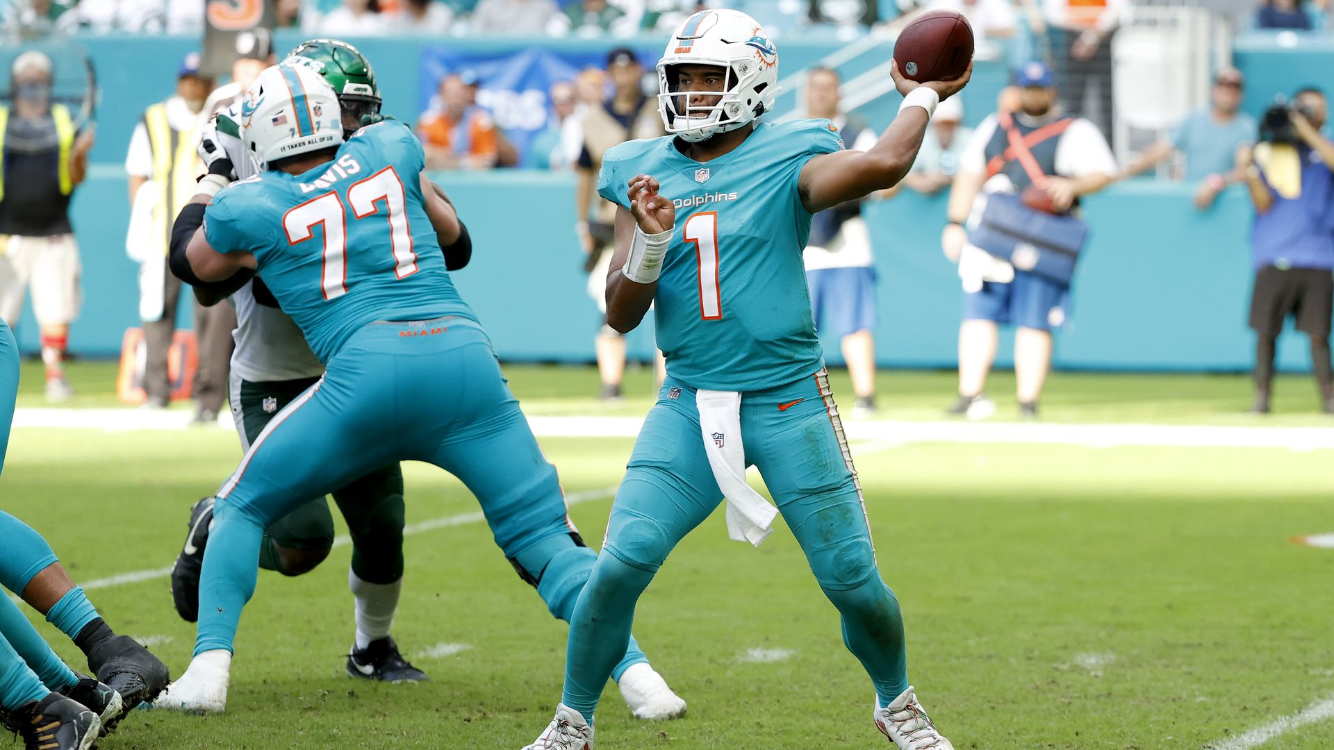Tua Tagovailoa #1 of the Miami Dolphins looks to make a pass play against the New York Jets in the second half at Hard Rock Stadium on December 19, 2021 in Miami Gardens, Florida. 