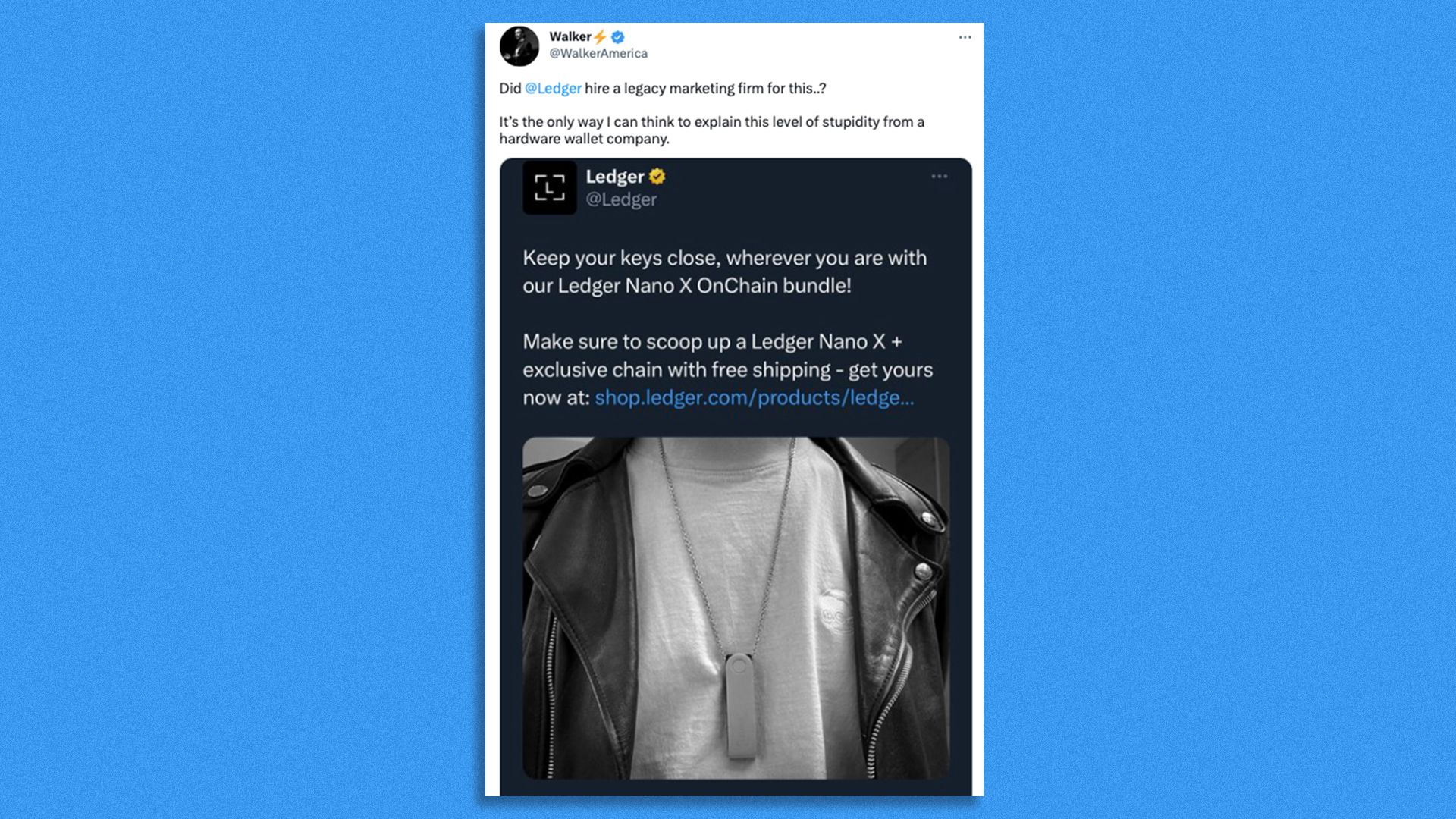 Photo of an outfit: white tee, black leather jacket, and a chain with a crypto hardware wallet as pendant