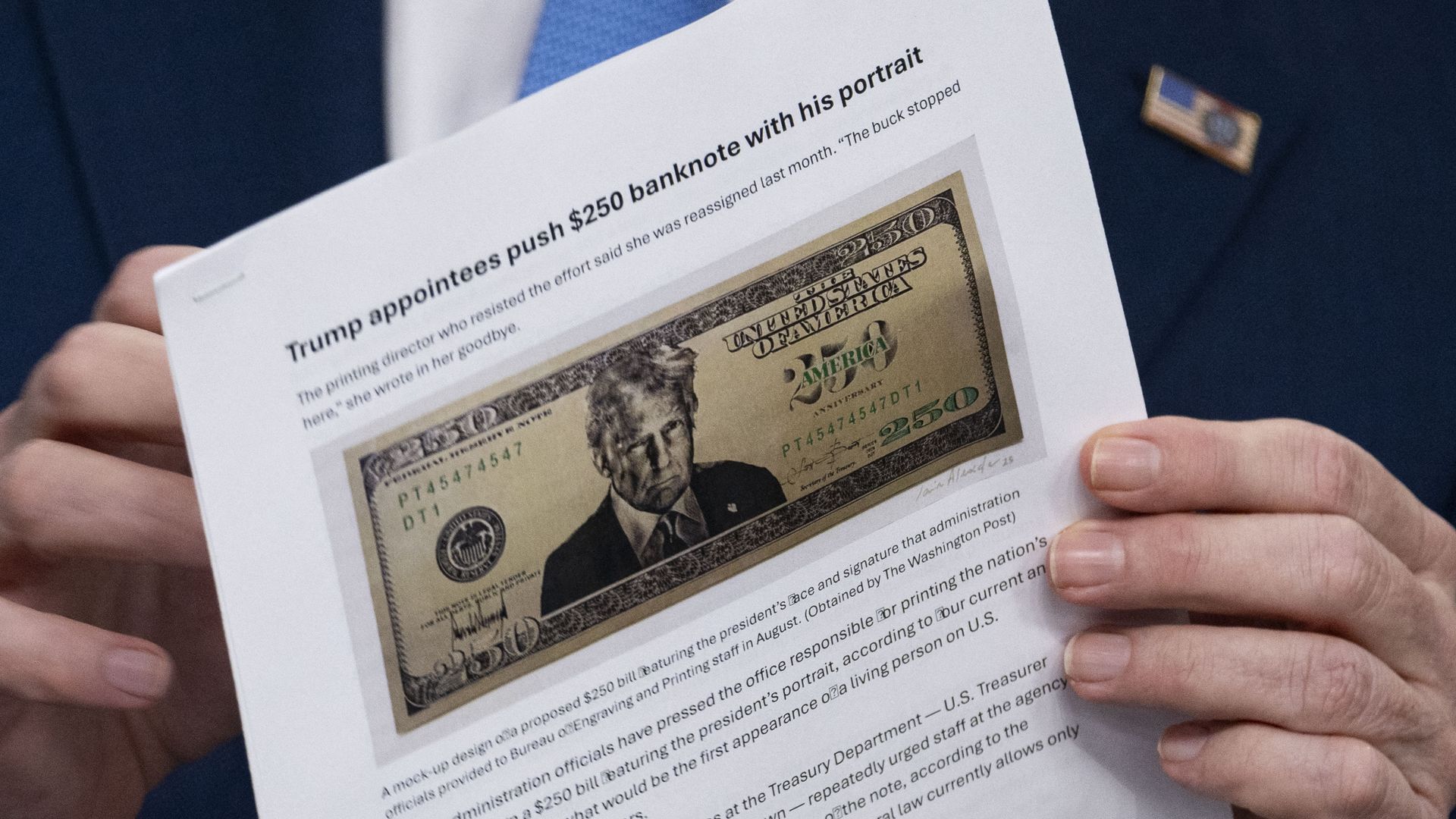 US Secretary of Treasury Scott Bessent shows a proposed $250 bill featuring President Donald Trump during a press briefing in the Brady Briefing Room of the White House in Washington, DC, on May 28, 2026.