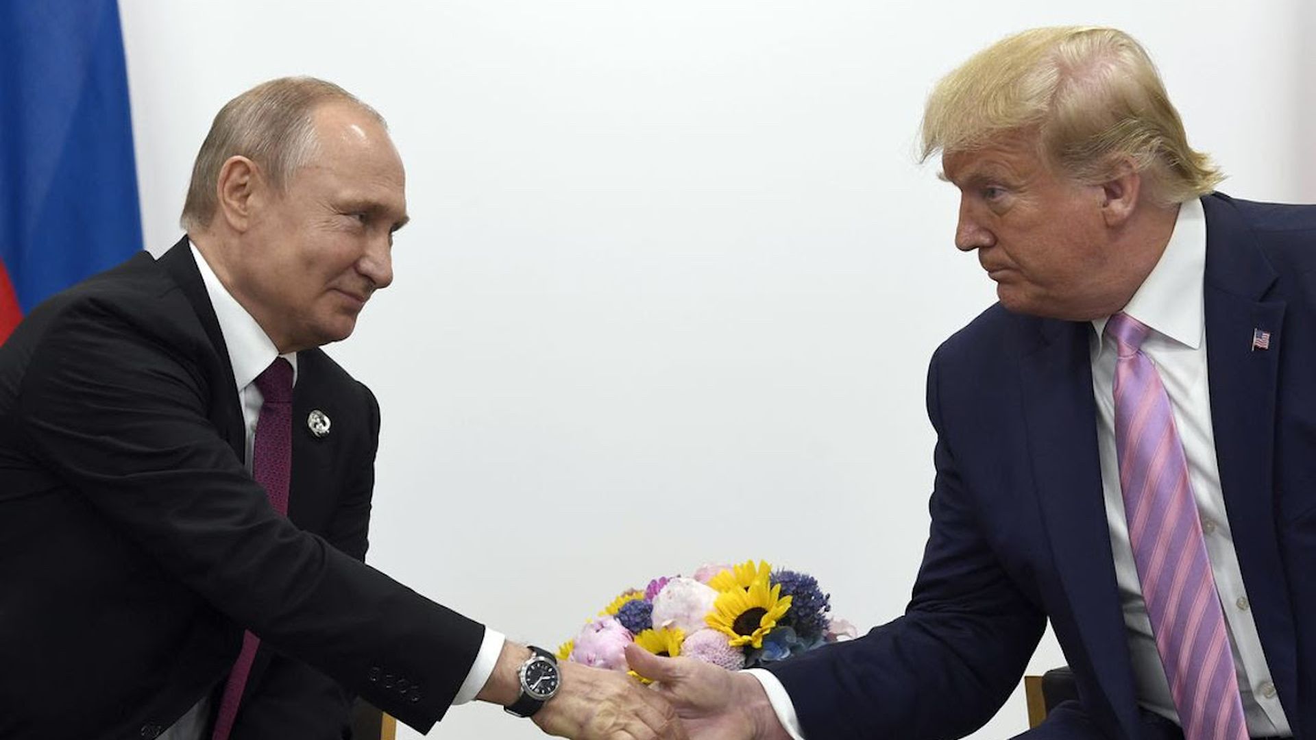 President Trump shakes Russian President Vladimir Putin's hand