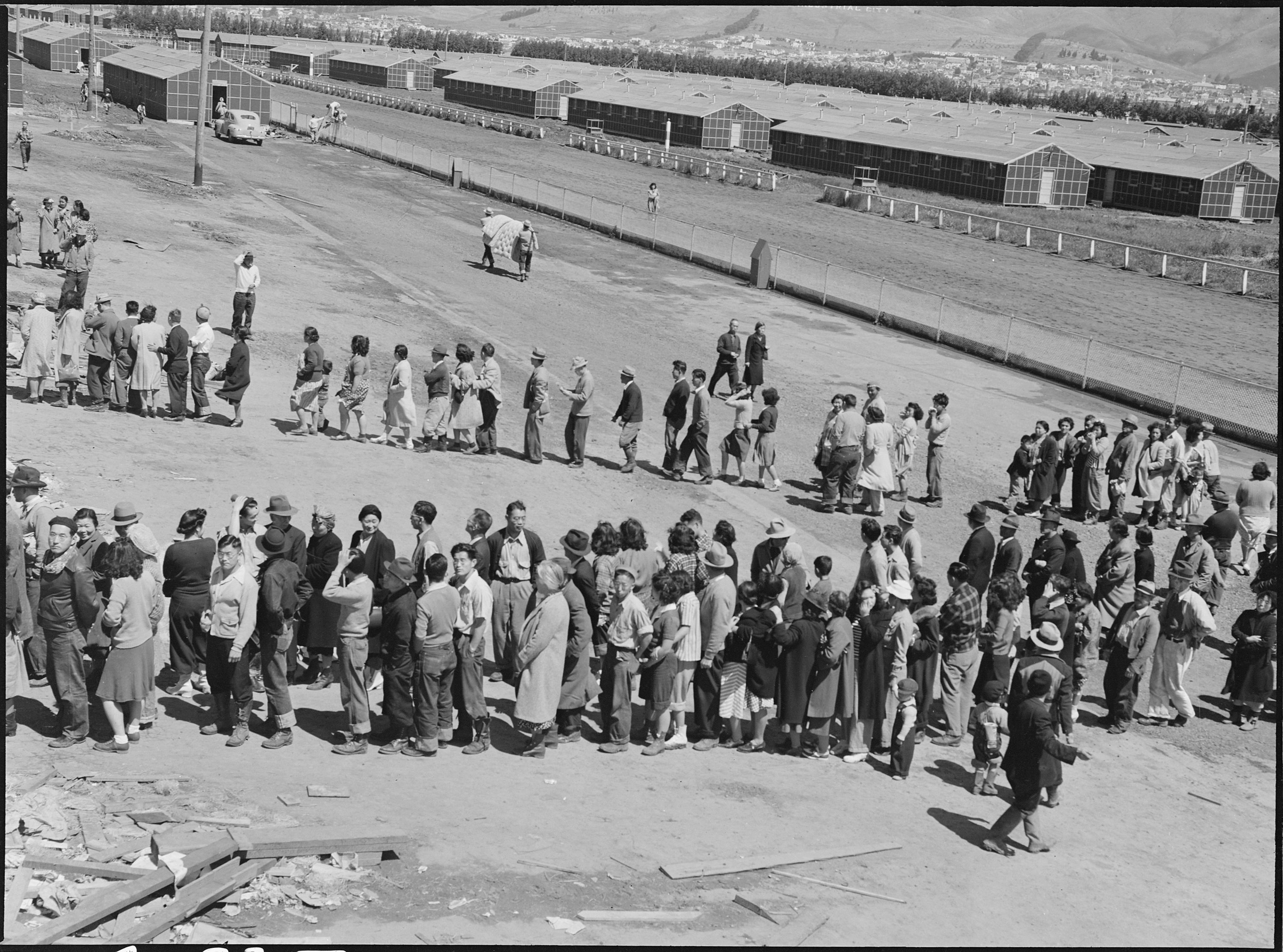 People line up on a former race track.