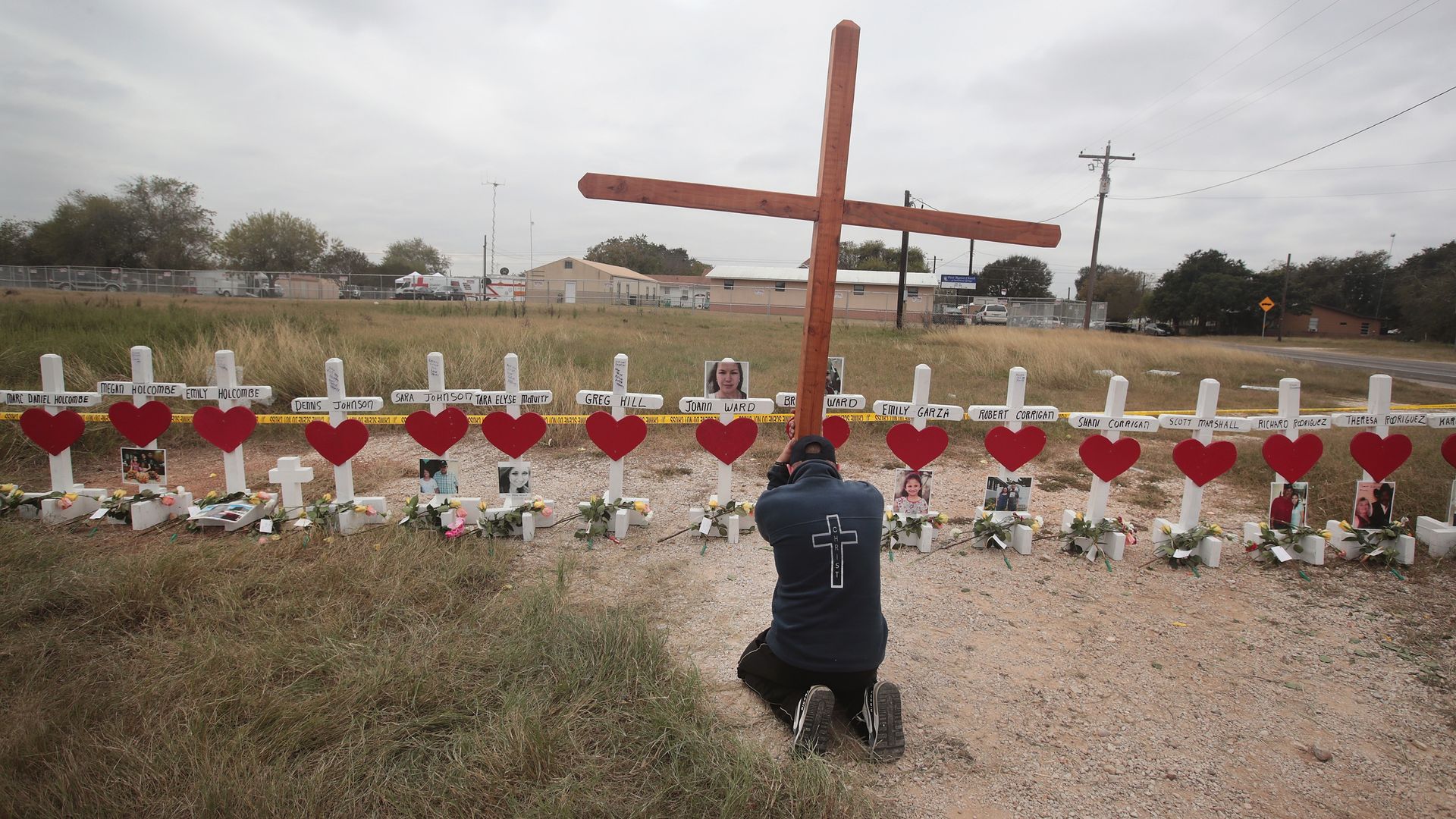 A man prays at a memorial where 26 crosses were placed to honor the 26 victims killed at the First Baptist Church of Sutherland Springs on November 9, 2017 in Sutherland Springs, Texas. 