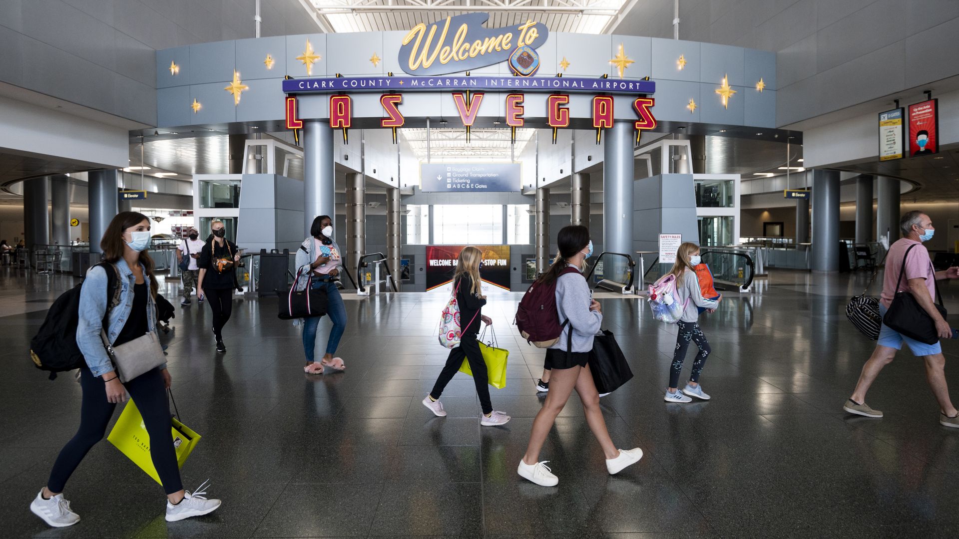 Passengers wearing face masks at McCarran International Airport in Las Vegas in June.