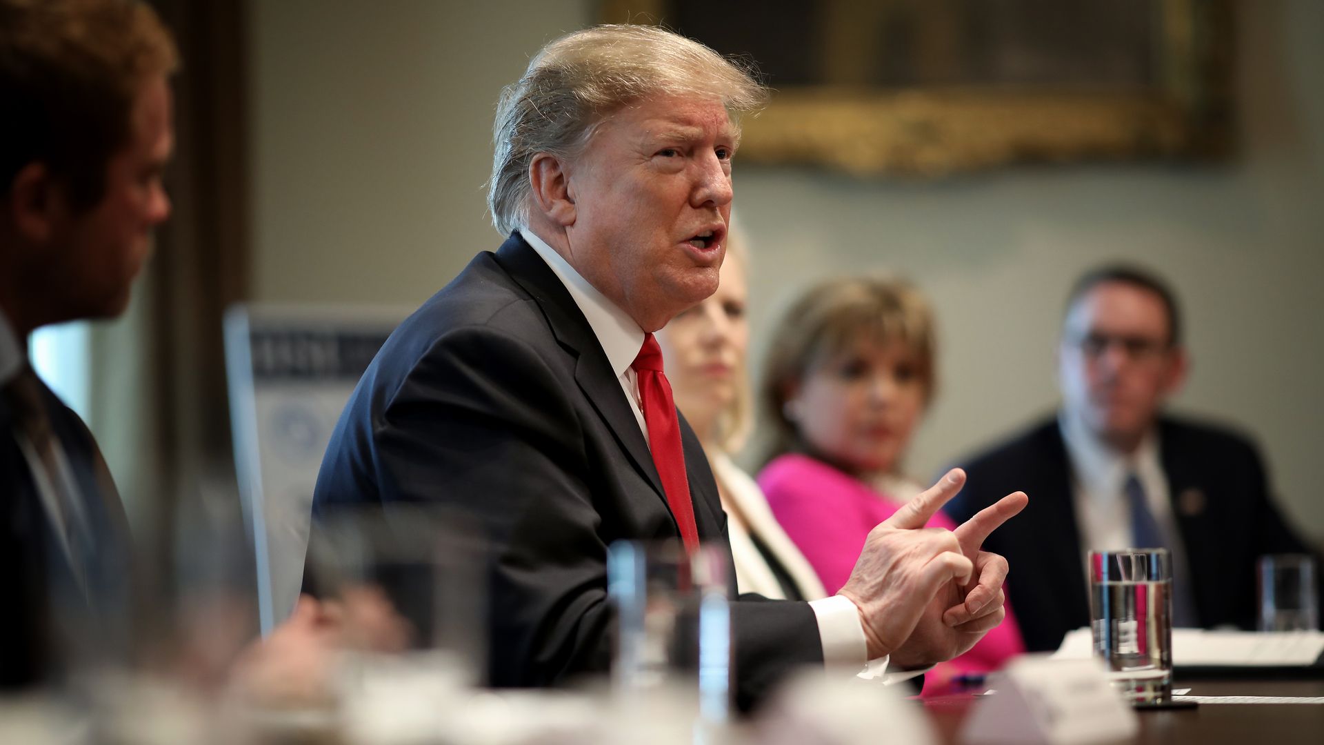 Photo of Trump in a meeting.