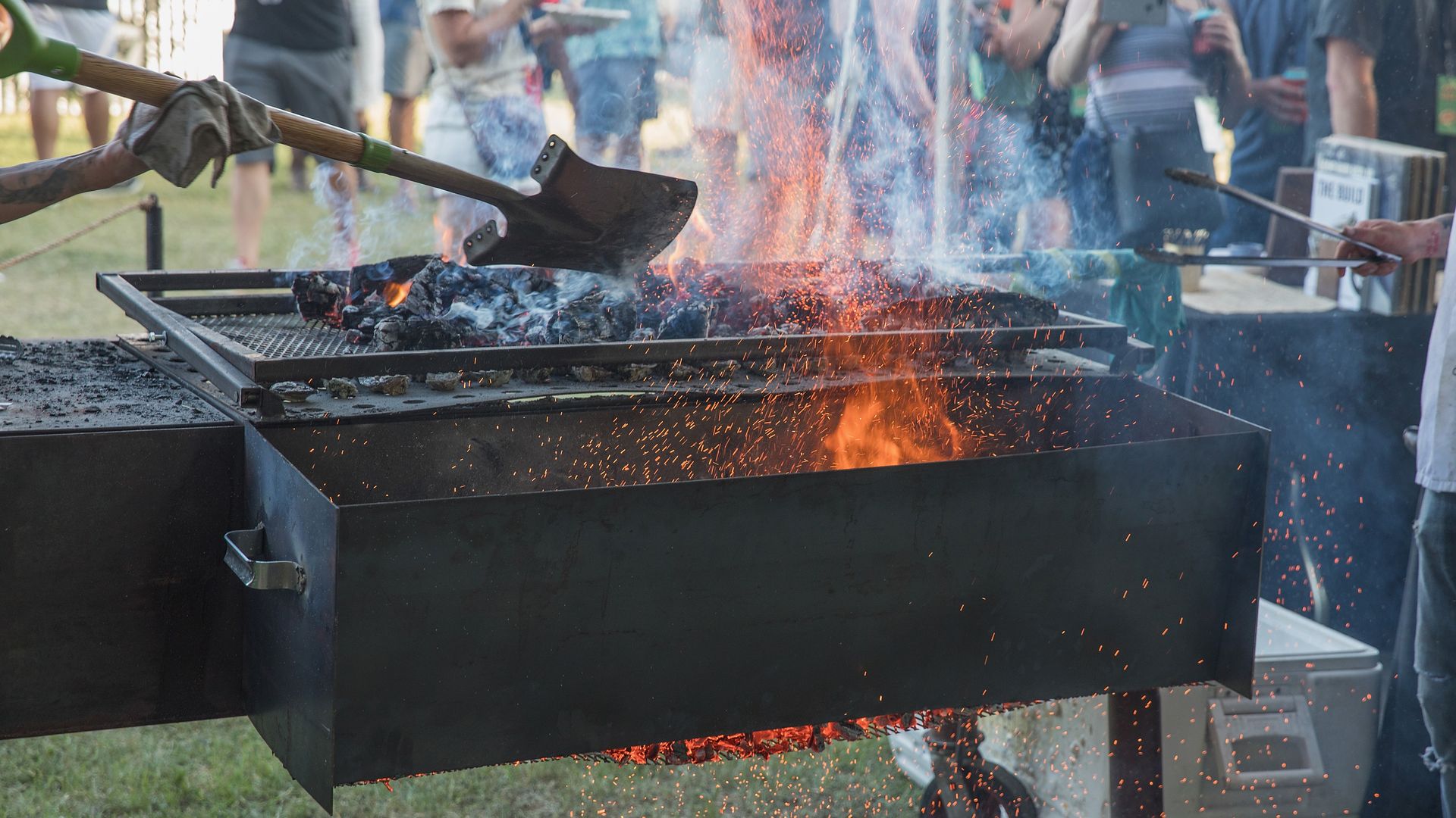 A photo of a shovel above flames.