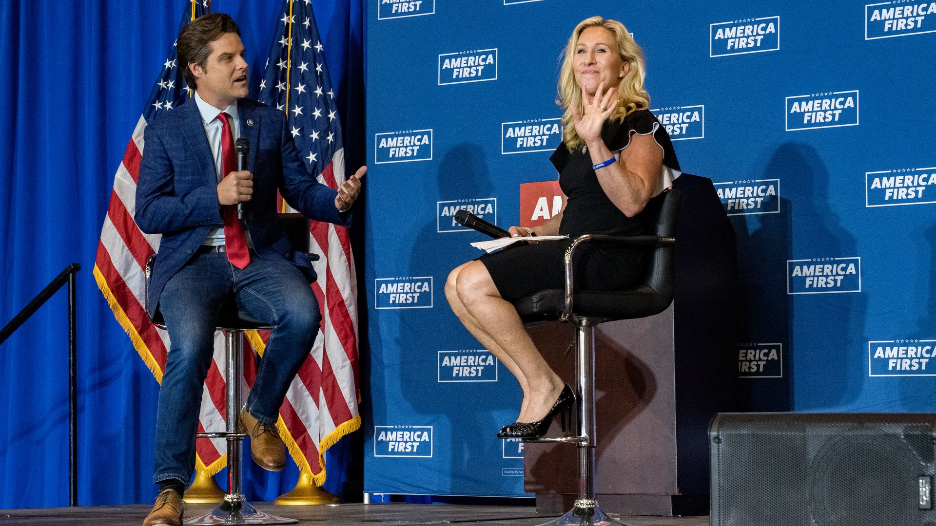 Reps. Marjorie Taylor Greene (R-GA) and Matt Gaetz (R-FL) speak at an America First Rally on May 27, 2021 in Dalton, Georgia.