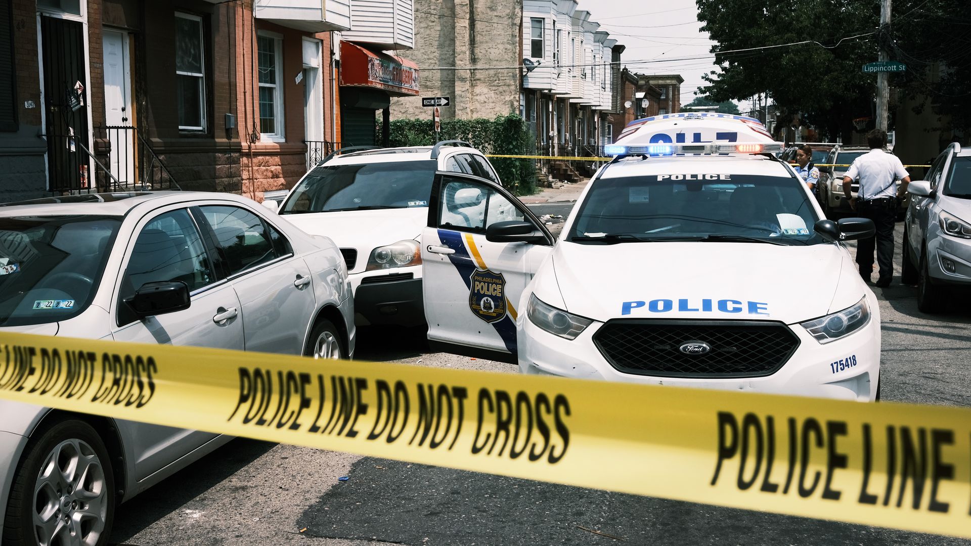 Police tape blocks a street where a person was recently shot in a drug related event in Kensington on July 19, 2021 in Philadelphia, Pennsylvania.