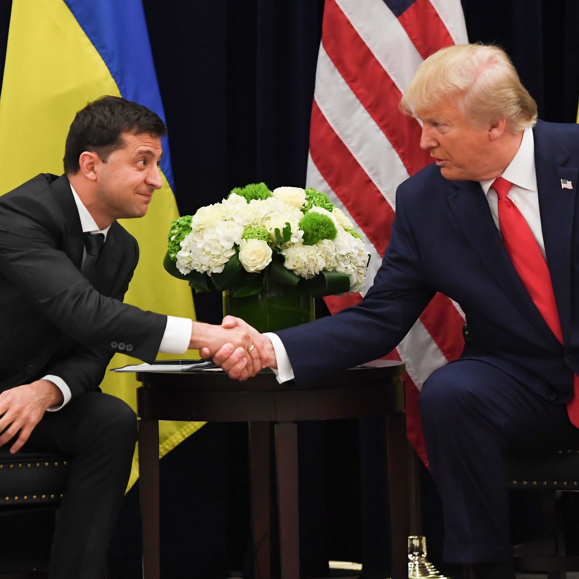 President Trump and Ukrainian president Volodymyr Zelensky shake hands