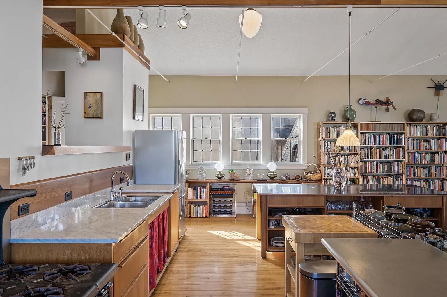A photo of a kitchen with wood cabinets and countertops.
