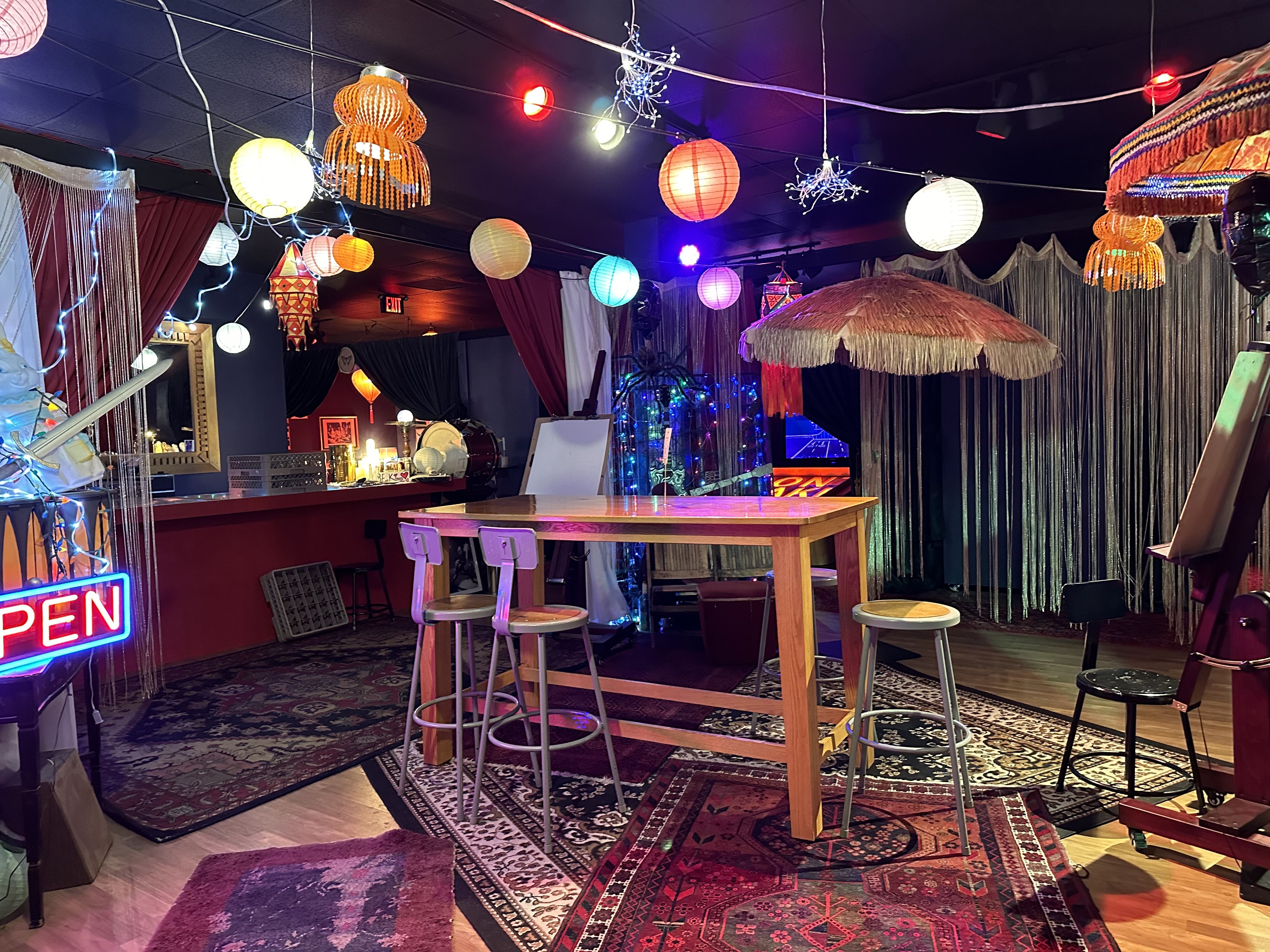 A worktable surrounded by funky lamps 