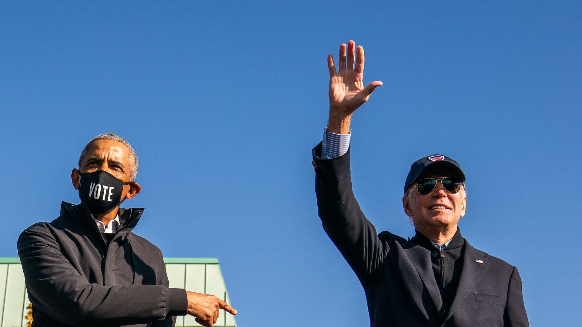 Former Vice President and presidential nominee Joe Biden and President Barrack Obama on stage during a mobilization event at Northwestern High School in Flint, Michigan on October 31, 2020. 