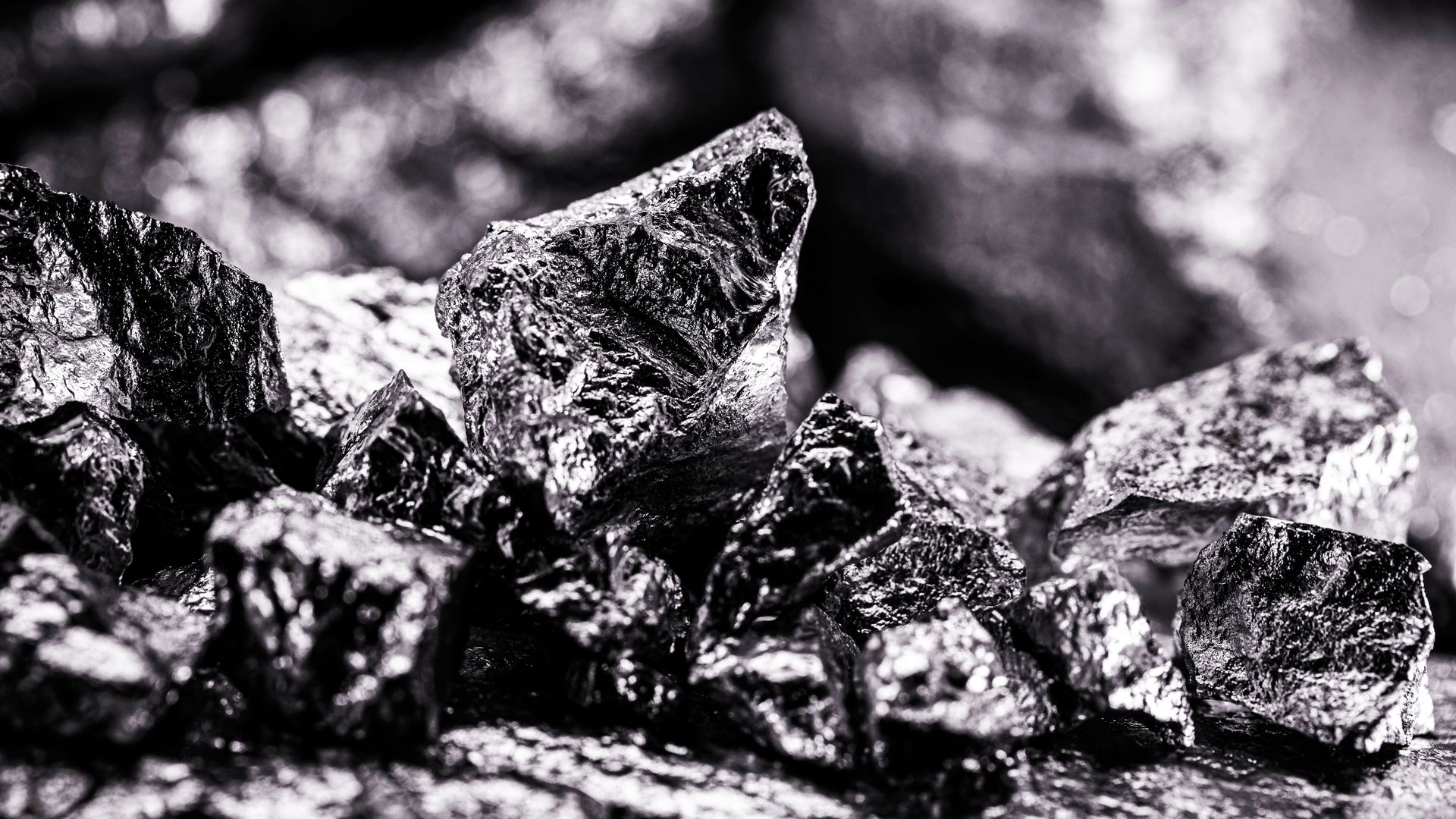 Black and white picture of palladium, consisting of dark yet shiny rocks. 