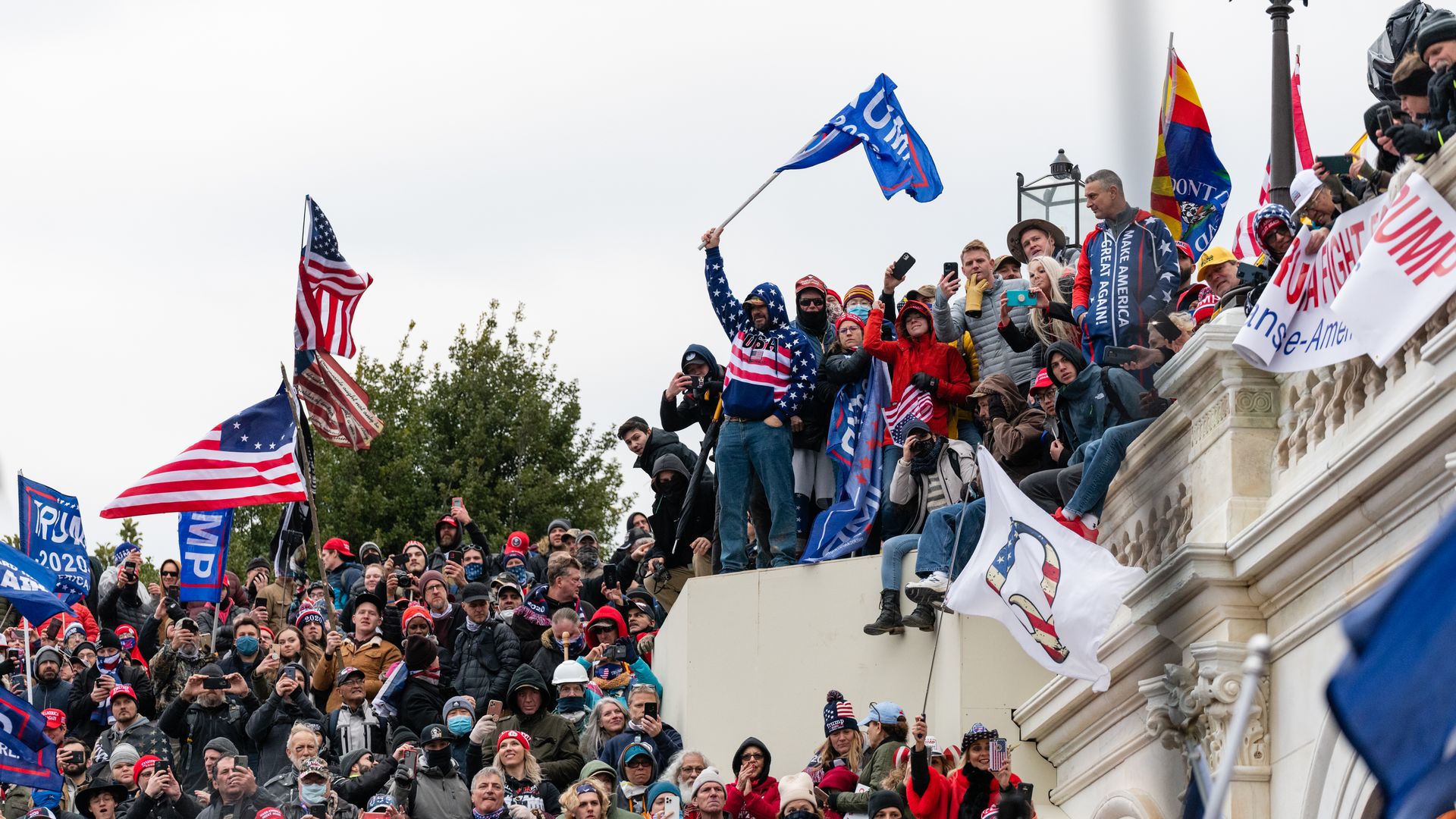 Demonstrators swarm the U.S. Capitol building during a protest in Washington, D.C., U.S., on Wednesday, Jan. 6, 2021.