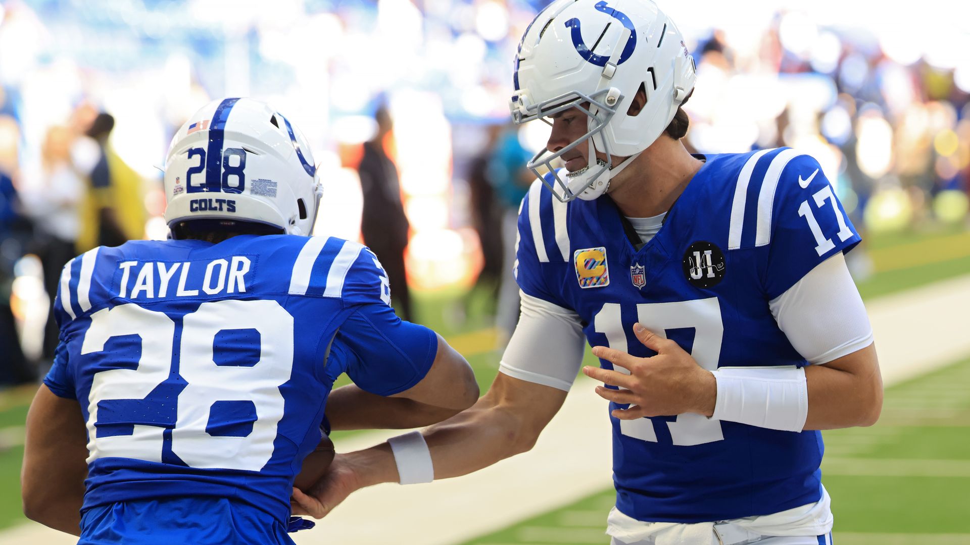 Daniel Jones #17 of the Indianapolis Colts warms up with Jonathan Taylor #28 of the Indianapolis Colts against the Arizona Cardinals before the game at Lucas Oil Stadium on October 12, 2025 in Indianapolis, Indiana.