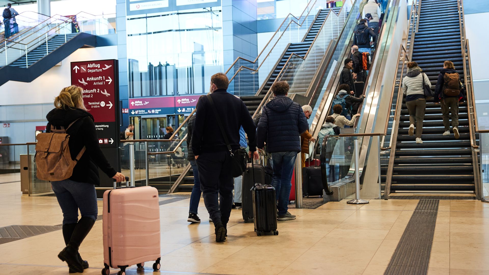 17 October 2024, Brandenburg, Schönefeld: Numerous people take the escalator to the check-in counters at BER Airport. US President Biden's visit to Germany is associated with numerous traffic restrictions. Photo: Joerg Carstensen/dpa (Photo by Jörg Carstensen/picture alliance via Getty Images)