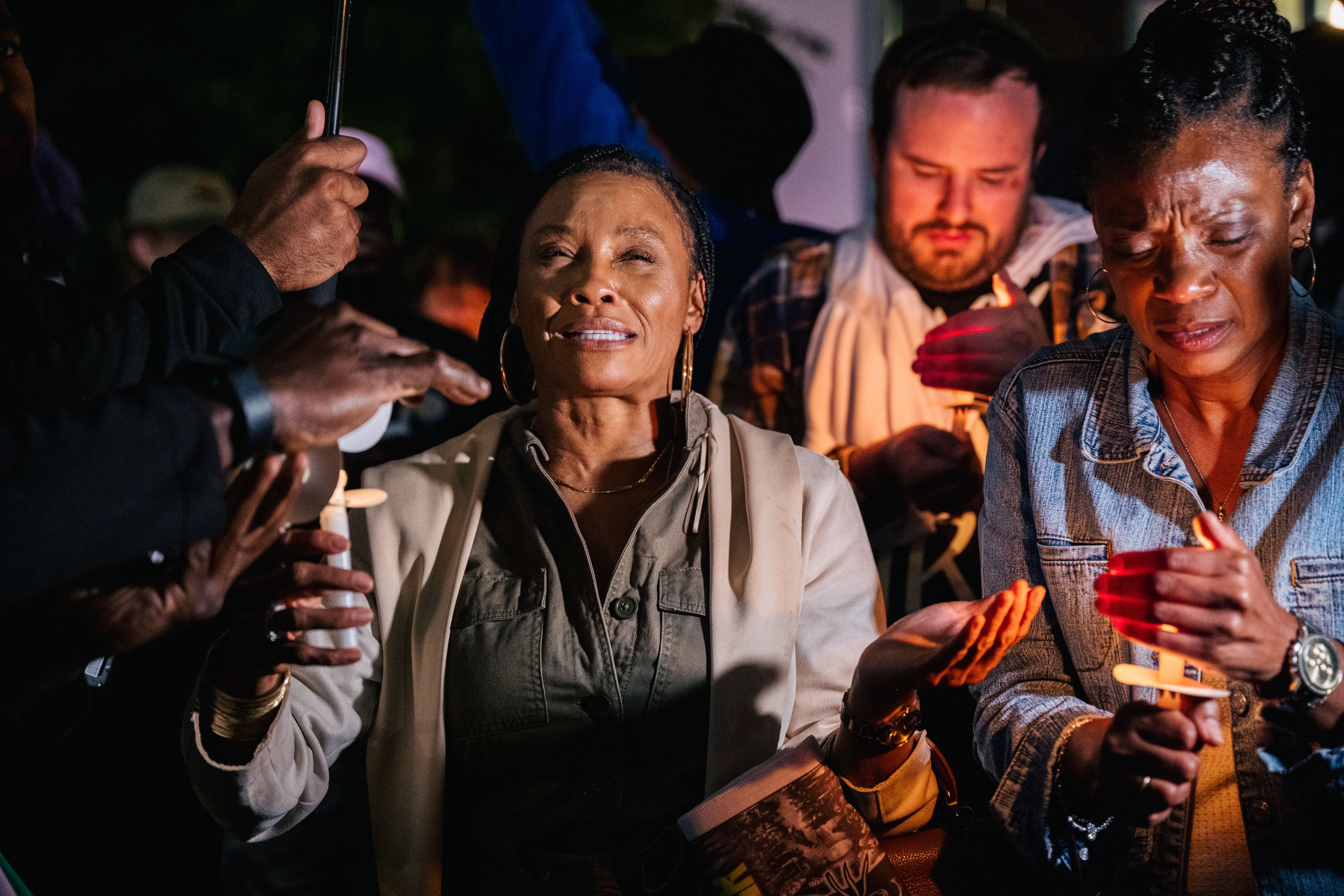  A woman cries out while attending a candlelight vigil in the Greenwood district during commemorations of the 100th anniversary of the Tulsa Race Massacre on May 31