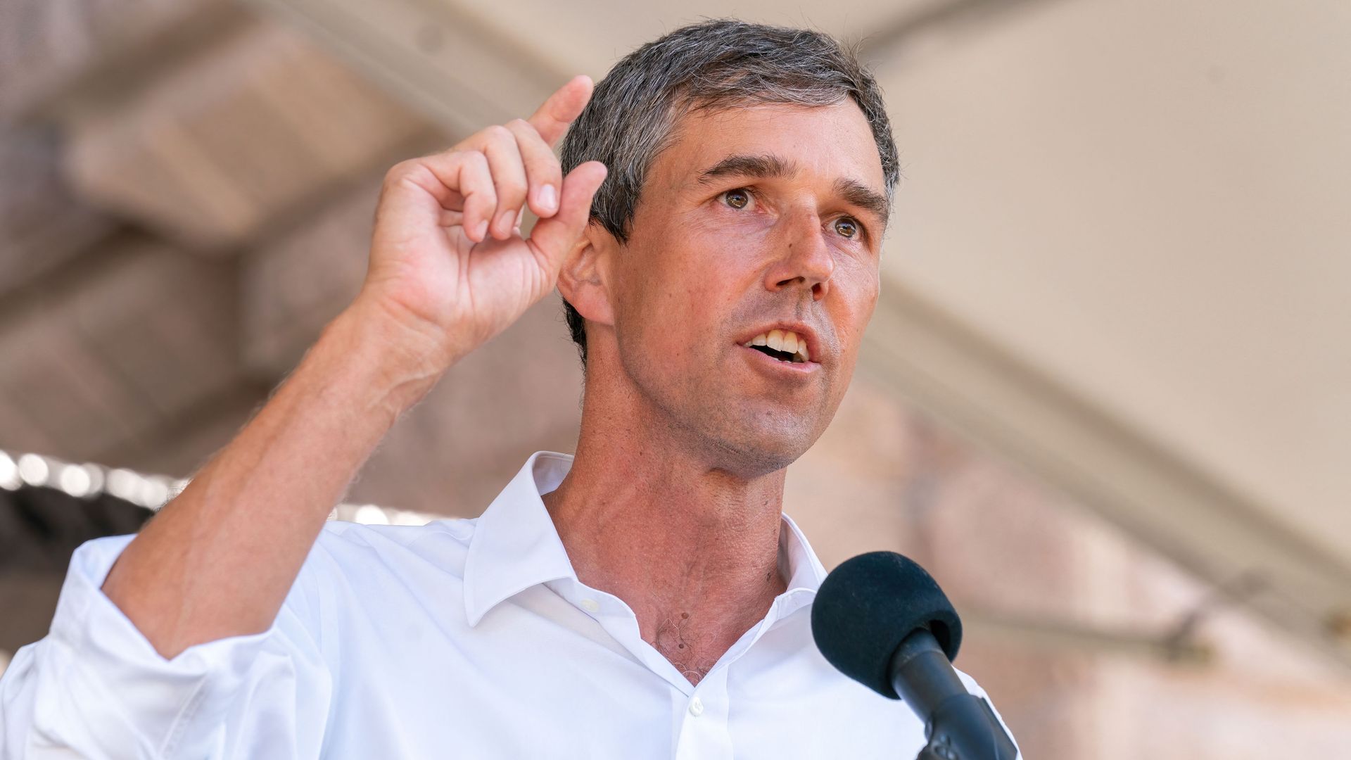 Beto talks into a microphone