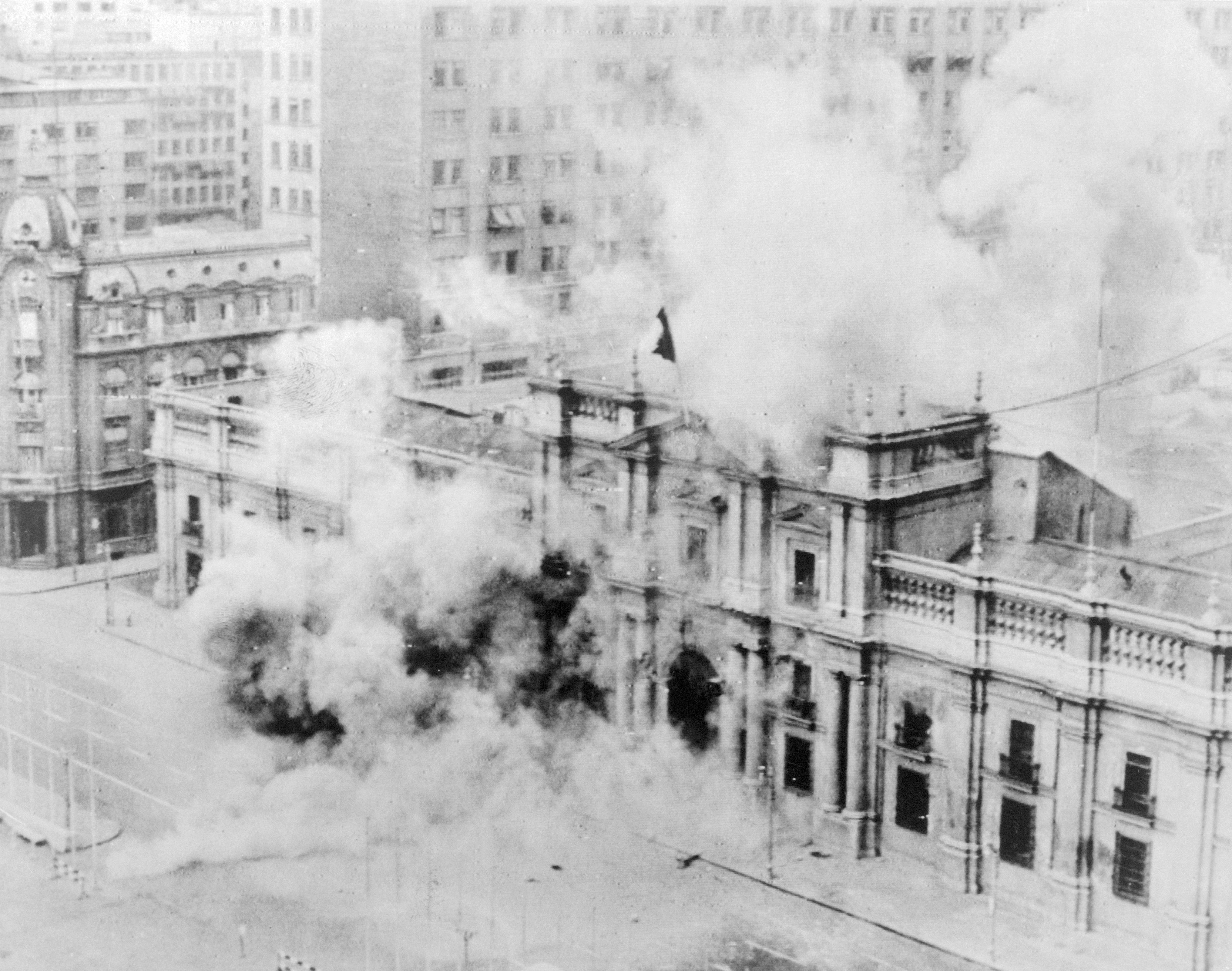 Chile's national palace is seen being engulfed in smoke during a coup on September 11, 1973