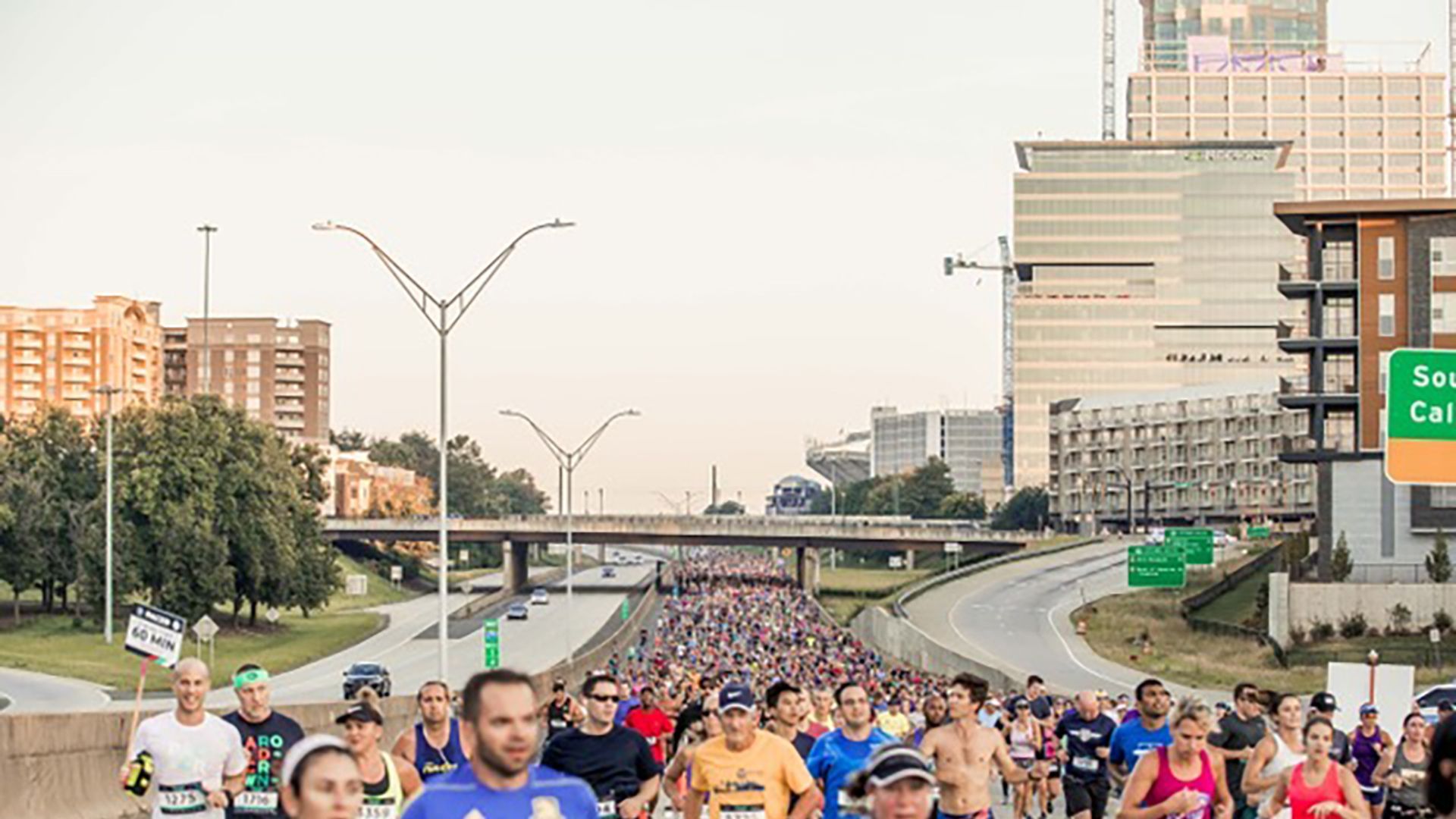 thousands of runners on Interstate 277 in Charlotte for the Around the Crown 10K