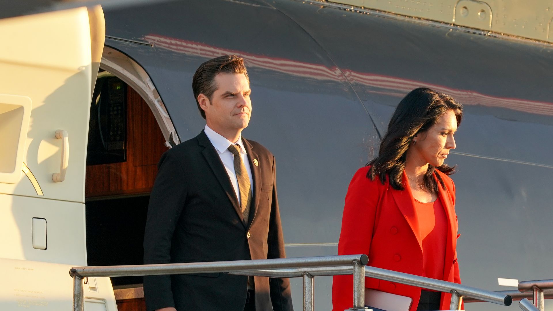 Matt Gaetz and Tulsi Gabbard exit the Trump Organization's plane.