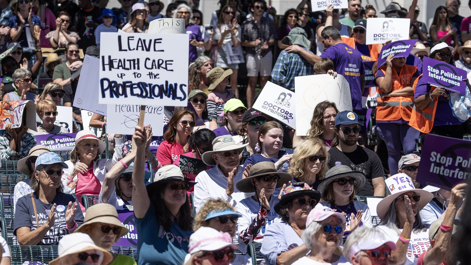 Abortion rights advocates march and rally in support of the Yes On 4 campaign in downtown Orlando, F