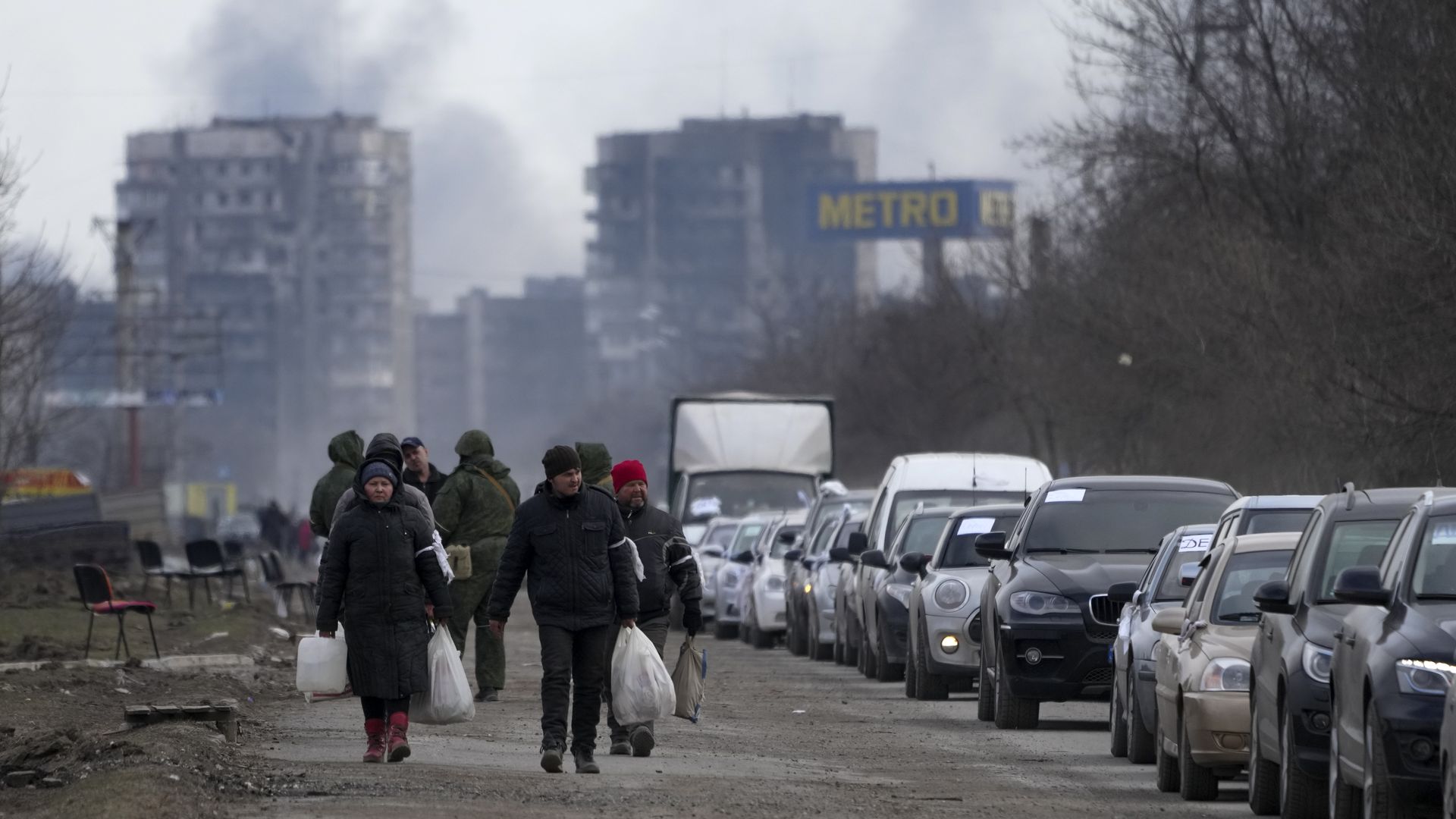 Civilians trapped in Mariupol city under Russian attacks, are evacuated in groups under the control of pro-Russian separatists, through other cities, in Mariupol, Ukraine on March 20.